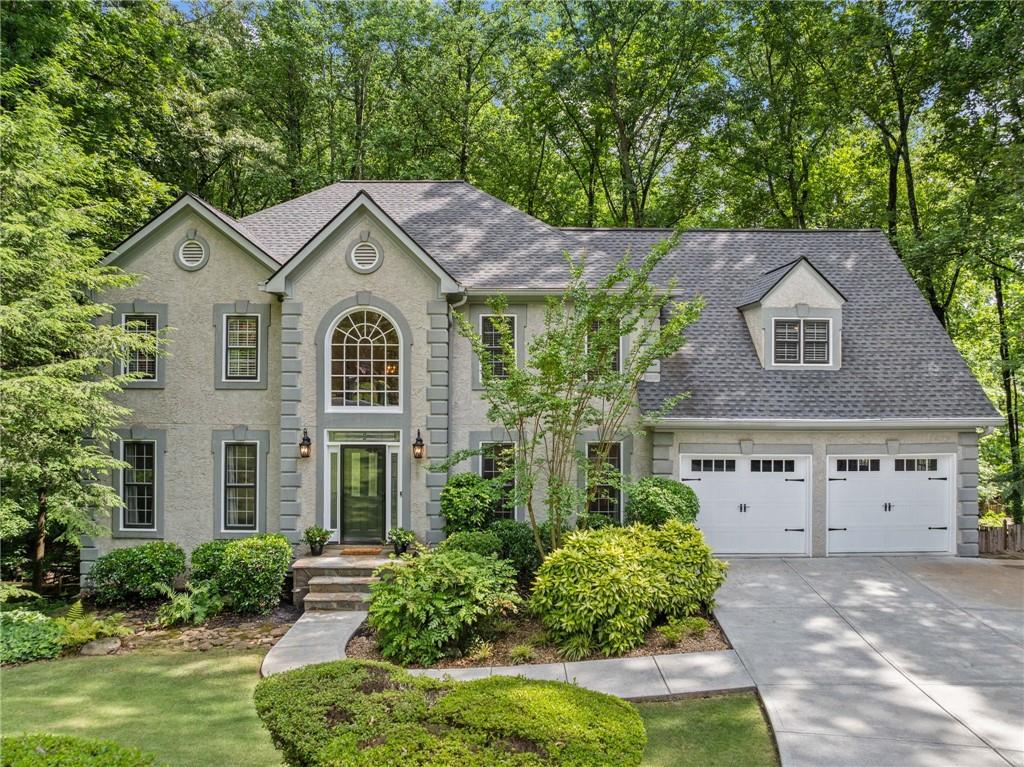 Beautiful and Elegant, Updated Home in One of East Cobb’s Premier Swim/Tennis Communities - Windsor Oaks!
Experience the perfect blend of charm, comfort, and functionality in this beautifully maintained home, ideally located on a private cul-de-sac in one of one of East Cobb’s most sought-after communities. With manicured landscaping, a new deck, and fresh interior and exterior paint, this home offers impressive curb appeal and welcoming spaces inside and out.
Enter through the grand two-story foyer featuring a dramatic wrought iron staircase, chandelier, and warm hardwood floors. The formal living room with French doors provides a quiet, versatile space—ideal for a home office or library.
The heart of the home is the spacious kitchen, thoughtfully designed with cherry cabinetry, granite countertops, stainless steel appliances, under-cabinet and recessed lighting, and an Electrolux induction cooktop, double ovens, and warming drawer. Gather around the large island or enjoy casual meals in the sun-drenched breakfast nook.
The adjoining family room with custom built-ins and a gas fireplace invites relaxation. Step into the expansive screened-in porch with a stunning stacked stone wood-burning fireplace, vaulted cedar ceiling, and serene wooded views—an ideal space for both everyday enjoyment and entertaining. The sunroom flows onto the newly built deck, perfect for grilling or relaxing, and the fenced backyard offers privacy and space to unwind.
Upstairs, the generous primary suite features hardwood floors and a tranquil spa-inspired bathroom with quartz countertops, heated tile floors, a freestanding soaking tub, frameless glass shower with rain showerhead, marble tile, a shower bench, and a custom walk-in closet. Four additional bedrooms and two stylish full baths provide room for family, guests, or flex use.
The finished terrace level includes a kitchenette, full bath, and private guest or teen suite with a separate walkout to its own deck—perfect for entertaining, multi-generational living, or game-day gatherings.
Enjoy access to top-rated schools and outstanding neighborhood amenities, including an Olympic-sized pool, lighted tennis courts, event pavilions, playground, and an active social calendar. This is more than just a house—it’s a place to truly feel at home!