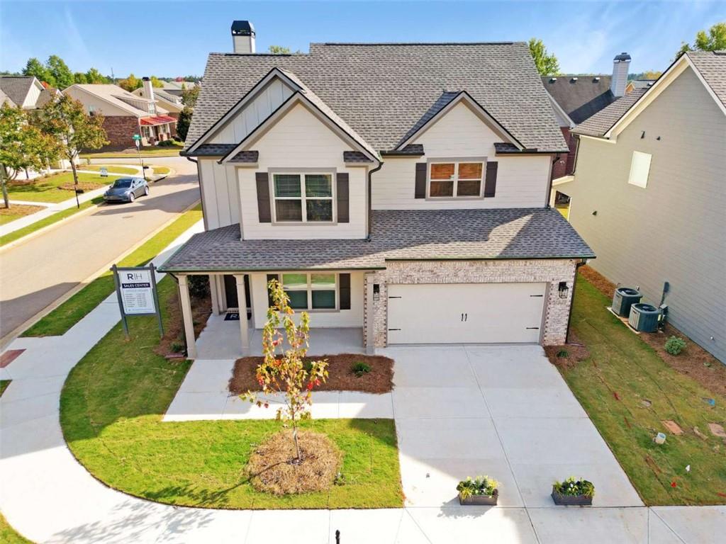 This Dylan A.1 Plan served as the Model Home for our Ridge Pointe Community. Its professionally decorated with beautiful furniture thats included with the sale. Some of the upgrades included are, Rev Wood flooring in the living areas, gourmet kitchen set up, quartz counter tops in kitchen, pendant lights over kitchen countertops, bricked fireplace to ceiling in Family Room, tiled master shower with frameless shower door in master bath, covered back porch just to name a few. This home sets on a corner lot and has extra windows, which brings in natural light, giving the home a vibrant, cozy energy thats can make any day relaxing. Located in Athens Ga, minutes from UGA, this home is a must see!
