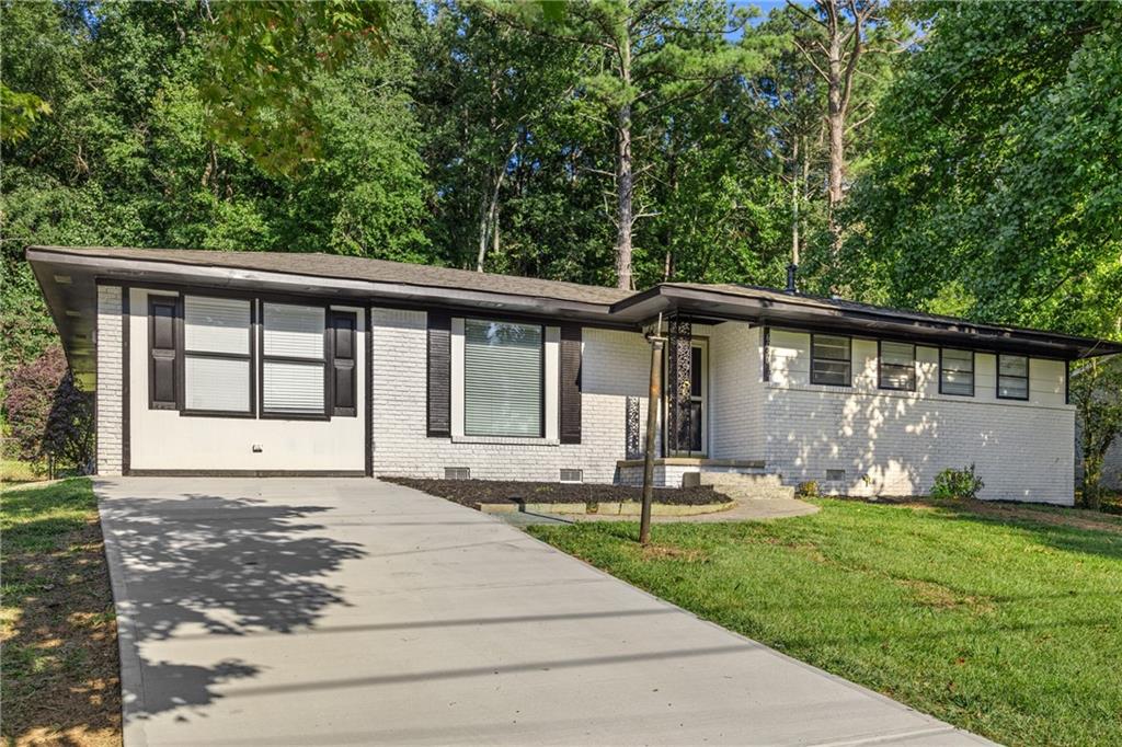Step into this beautifully renovated 4-bedroom, 2-bathroom home located in the heart of a family-friendly Forest Park neighborhood. From top to bottom, this property has been refreshed with modern updates and thoughtful design, making it an incredible opportunity for both investors and savvy homebuyers alike.
Inside, you’ll find brand-new flooring throughout, fresh interior and exterior paint, and updated light fixtures that bring a bright, welcoming feel to every room.
The kitchen has been completely transformed, featuring freshly painted cabinets, quartz countertops, new appliances, and a custom island perfect for meal prep or entertaining.Both bathrooms have been fully remodeled with stylish finishes, and the primary suite now includes a second closet for added convenience. This spacious home also offers two additional living areas—one that can be used as a bedroom, office space, or family room—plus a sunroom that’s perfect for relaxing. Additional updates includes a new driveway with ample space for several cars. For your peace of mind, the hot water heater, HVAC system, and roof are all only a few years old, ensuring longevity and comfort for years to come. Outdoors, the generous backyard with a storage shed offers endless possibilities for gardening, play, or entertaining. All this, just under 20 minutes to Hartsfield-Jackson International Airport and close to local parks, shopping, and dining.
Whether you’re searching for your next investment, rental property, or a forever home, this move-in ready gem is a must-see!
***Some images have been virtually staged to better showcase the true potential of rooms and spaces in the home.