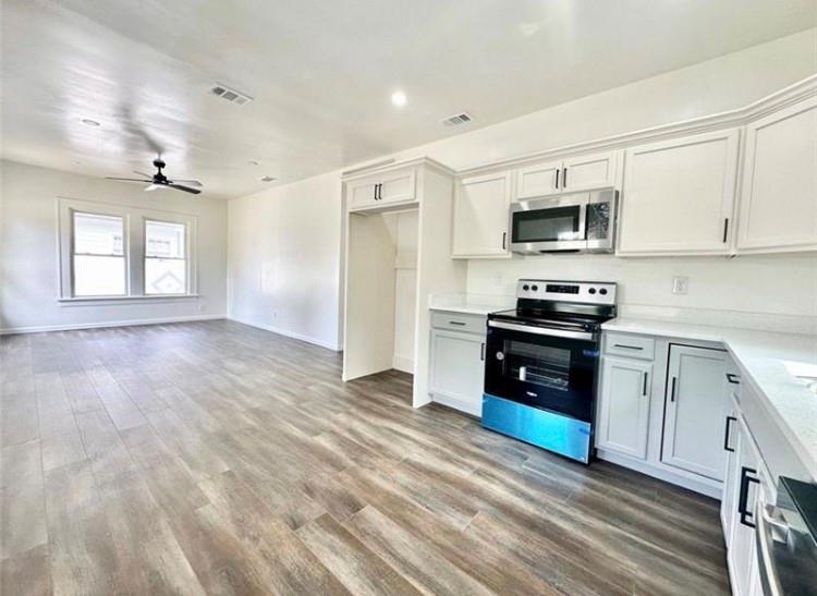 Completely renovated Bunglaw home. 3 bedroom, 2 bathroom. Brand new flooring throughout the home. The open concept and tons of natural light creates an inviting and bright home. Brand new white cabinets, counters, and stainless steel appliances that are still wrapped. The master bedroom has a large walk-in closet and beautiful large full master bath. The two other large bedrooms have great closet space and large windows to bring in natural light. The hallway ends with a nice double stack washer and dryer. The exterior is prefect for bbq's, kids, and pets. The yard is completely fenced in and the large back deck is great for a patio set and grill. Pets are welcome with a pet deposit. A deposit is optional: either pay the deposit the traditional way or contact Rhino insurance for a deposit insurance policy and pay only dollar's a month to cover your deposit. The house is vacant and move-in ready. Must see.
