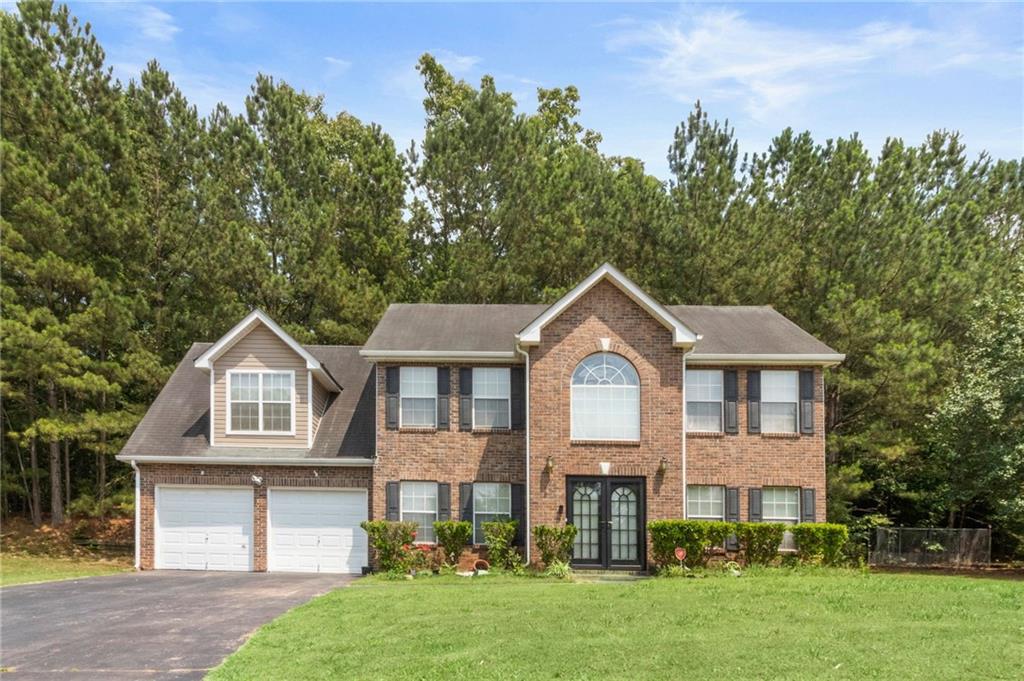Welcome to the charming Chester Hills in Stone Mountain! This beautiful brick-front home has 4 bedrooms, 2.5 bathrooms, and a 2-car garage with kitchen entry. Feel luxurious as you enter through the double doors to the spacious 2-story foyer. You'll find ample entertainment space with a sizeable family room, living room, and formal dining room. The kitchen is large and cozy for intimate family breakfasts that can be cooked and enjoyed on the eat-in breakfast bar. Upstairs you will find the primary bedroom and bathroom with tray/vaulted ceilings and spacious secondary rooms. Located minutes from shopping centers, most major highways, and Stone Mountain Park. Buyers tell your realtors, and realtors tell your buyers!