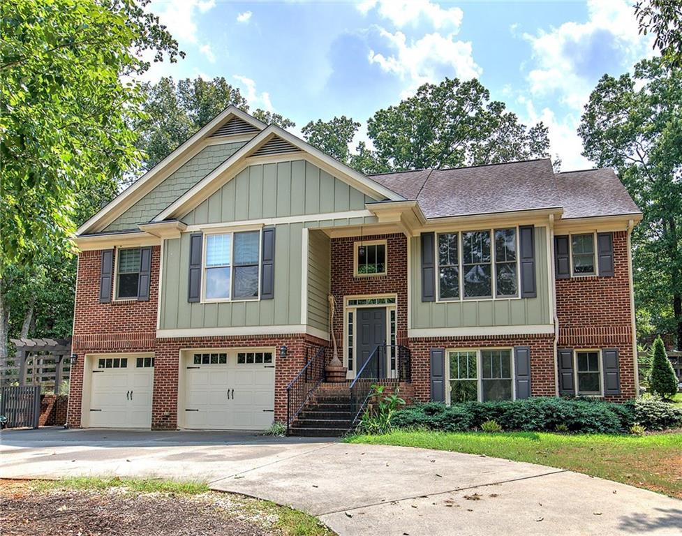 Beautiful 4BR/3BA Home on Private Wooded Lot in Cartersville School District - Tucked away on a serene, private wooded lot in a sought-after swim/tennis community, this spacious 4-bedroom, 3-bathroom home offers the perfect blend of comfort, style, and functionality — all within the desirable Cartersville City School District. Step inside to a welcoming great room with soaring vaulted ceilings and a cozy central fireplace, creating an ideal space for relaxing or entertaining. The formal dining room and sunny eat-in kitchen provide multiple dining options to suit any occasion. The kitchen is a chef’s dream — featuring granite countertops, stained cabinetry, stainless steel appliances, a breakfast bar, and a massive walk-in pantry for all your storage needs. Retreat to the luxurious master suite, complete with vaulted ceilings, a peaceful sitting area, and a spa-inspired bath boasting double vanities, a walk-in shower, a soaking tub, and a large walk-in closet. Downstairs, the fully finished lower level includes a second living area or game room, a large laundry room with a mud sink, the fourth bedroom, and a full bathroom — perfect for guests, teens, or a private office space. Enjoy the outdoors year-round from the large screened-in back porch overlooking the fenced backyard. Additional features include an oversized garage with a workshop/storage area, a circular driveway for ample parking, and high-speed fiber optic internet — ideal for remote work or streaming. Don’t miss your chance to own this incredible home in a vibrant, family-friendly community!