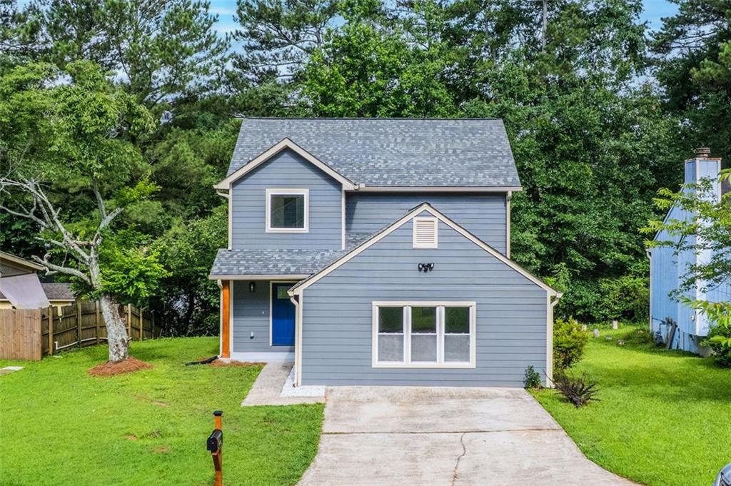This beautifully renovated home offers 4 spacious bedrooms and 3 full bathrooms, thoughtfully designed for modern living. As you enter, you’ll be greeted by an open-concept main floor featuring a fully updated kitchen with stunning quartz countertops, sleek white cabinetry, and stainless steel appliances. The first floor also includes a full bedroom and bathroom — perfect for guests or multi-generational living. Upstairs, you'll find three additional bedrooms and two fully renovated bathrooms. The luxurious primary suite boasts a double vanity, a soaking tub, and a walk-in shower. The secondary bathroom features elegant tile work and high-end finishes. All major systems have been replaced — including HVAC and plumbing — giving you peace of mind and energy efficiency for years to come. Don’t miss the opportunity to make this move-in ready gem your new home!