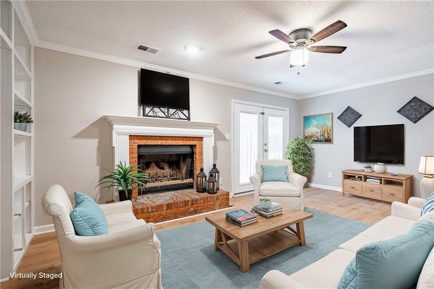 Ask about getting up to $10,000 in down payment assistnace and a lower rate with preferred lender's special offer in this area. Updated fee simple townhouse on quiet street. Close to Downtown Smyrna and Historic Marietta. Freshly painted inside and out. New plank flooring throughout. New faucets, lighting, blinds, ceiling fans. The kitchen has a cute dining space, stainless steel appliances, white cabinets and a pantry. The great room features a fireplace with a gas starter and a custom wall of bookshelves and TV mounting space. French doors lead to a large deck, storage and fenced back yard. Upstairs you'll find two spacious bedrooms with private bathrooms, walk in closets and lots of natural light. Laundry is on the main level. Two assigned parking spaces. Well maintained Homeowners Association with a dog run, dedicated parking pads for each unit and landscaping of the front yard is included. Easy access to 75, 285 and the airport. HOA has indicated they are open to allowing a rental if the property is managed locally and communication directly with the owner is established.