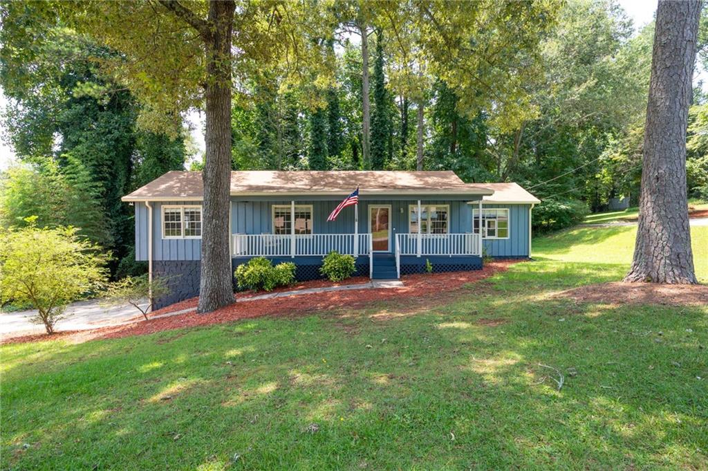 Welcome Home to this lovely Ranch! One level living with care and ease! Lovingly maintained and updated!! Large Welcoming Front Porch is perfect for morning coffee or relaxing afternoons. Oversized Great room with updated flooring and paint boasts a floor to ceiling stone fireplace! Room for everyone to gather! Updated Eat-in Kitchen offers Black appliances, granite countertops, subway tile backsplash and a bay window accent! 3 great bedrooms and 2 updated baths! All this plus a large deck off the great room, a finished room in the terrace level, a large walk in storage closet or office space in terrace level and 2 car garage!! Updated Systems! So near Downtown Woodstock, Shopping, Dining, Schools, and Parks! Woodstock living at its finest!