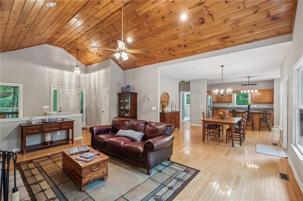 Nestled near the end of a serene Cul de sac, this beautiful mountain retreat overlooks a lush green -space forest that shifts from emerald to gold with the seasons. Floor to ceiling windows in the great room frame the ever-changing canopy, inviting natural light and wildlife into your daily life. The vaulted wood ceiling and stone fireplace capture the essence of rustic charm while offering modern comfort. This home's deck spans the rear facade, creating an ideal space for morning coffee or starlit dinners. You can hike directly from your driveway into miles of forested trails winding through Big Canoe's conserved green space. You will also be positioned in an amenity -rich mountain community with tennis courts, golf, clubhouse dinning, and lake access.
The seller has invested significant time and money in completely renovating this beautiful 3-bedroom ,3 bath home. Complete living is all on one level, master bedroom,2 bathrooms, office/tv room, open kitchen, open dining room, sunroom with bay windows, den with stone fireplace, laundry room and a deck with a screened in porch. A large drive under carport takes you safely from your car to your front door regardless of the weather. The MAJOR upgrades include 1. Completely remodeled kitchen 2. A resent new roof and chimney 3. New heating/ air conditioning system for main and terrace levels.4. New terrace level hardwood flooring. 5. New hardwood stairs. 6. Wildlife exclusion package. 7 Chimney cleaned and sealed. 8 New master bedroom carpet. 9. Repainted main level. 10. Termite control package. The sellers have created a fabulous mountain home for the next owner. The pictures provided will show an incredible opportunity to feel the serenity and warmth of a Big Canoe Mountain home. Also, Hickory Trail is a quiet Cul de sac street wither you are walking or taking your dog out for a stroll. THIS is a must see at only $ 479,000. CALL TODAY. ALSO- Seller is willing to pay buyer the $4,500. Big Canoe initiation fee at closing.