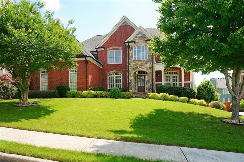 Move in ready within West Cobb perimeter. 3 sided brick, full/finished basement with tons of sq. footage and hardwood floors throughout main level. Open view from kitchen to family room w/ built in bookshelves is what you've been looking for! The basement has all your stay-cation needs. Full bar ready, exercise room w/ Dolby Atmos theater w/ 150" screen smart lighting. Security system already set up for you, including the Ring system. This is your one shot to move on up! Hurry, moving fast! The photos show well but you will be WOW'd in person!