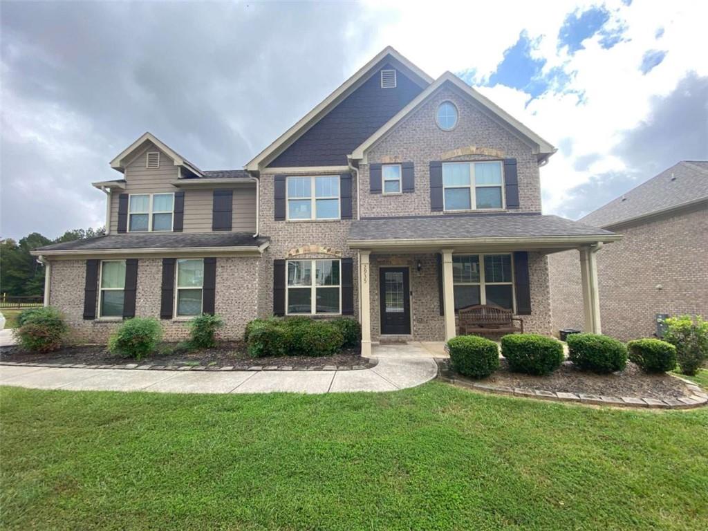 This is a rare opportunity! Welcome to 2935 Centennial Dr NE, a magnificent, like-new estate situated on a vast 0.6-acre lot in the highly sought-after, gated community of Centennial Village. Built in 2019 and spanning 3,051 square feet, this home presents an unparalleled opportunity for high-end living without the premium price tag. This spacious, 5-bedroom home is currently priced aggressively for a quick sale, offering immediate equity compared to similar homes in the exclusive Conyers area. Designed for flexible living, this stunning traditional home offers space for every need. The expansive main level showcases an open-concept floorplan with defined living, dining, and family rooms, perfect for grand entertaining or casual family gatherings. An invaluable feature for today’s buyer: a full bedroom and bathroom suite located on the main level! This is ideal for a private in-law suite, guest accommodations, or a highly coveted primary office. Upstairs, the luxury continues with four generous bedrooms, including a superb owner's suite that provides a true private sanctuary. Step outside to your private oasis, complete with a charming sitting porch and patio, all within the secure confines of the gated community. Enjoy the perks of a Golfer's Dream! The community is situated nearby the Cherokee Run Golf Club, an Arnold Palmer-designed championship course, and is just over a mile from the Georgia International Horse Park, offering world-class events, miles of scenic trails, and expansive parkland. Schedule your private tour today—this opportunity will not last!