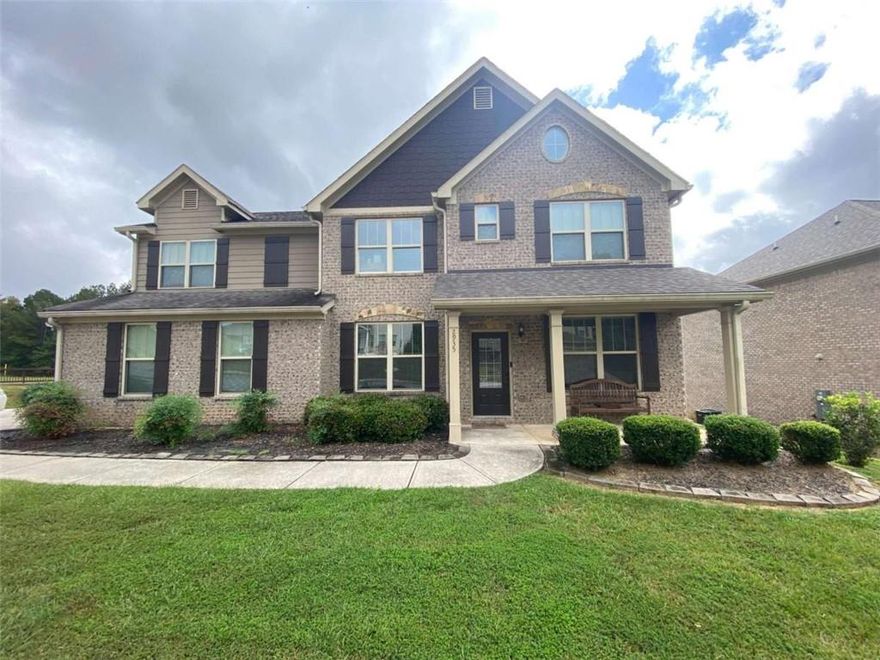 This is a rare opportunity! Welcome to 2935 Centennial Dr NE, a magnificent, like-new estate situated on a vast 0.6-acre lot in the highly sought-after, gated community of Centennial Village. Built in 2019 and spanning 3,051 square feet, this home presents an unparalleled opportunity for high-end living without the premium price tag. This spacious, 5-bedroom home is currently priced aggressively for a quick sale, offering immediate equity compared to similar homes in the exclusive Conyers area. Designed for flexible living, this stunning traditional home offers space for every need. The expansive main level showcases an open-concept floorplan with defined living, dining, and family rooms, perfect for grand entertaining or casual family gatherings. An invaluable feature for today’s buyer: a full bedroom and bathroom suite located on the main level! This is ideal for a private in-law suite, guest accommodations, or a highly coveted primary office. Upstairs, the luxury continues with four generous bedrooms, including a superb owner's suite that provides a true private sanctuary. Step outside to your private oasis, complete with a charming sitting porch and patio, all within the secure confines of the gated community. Enjoy the perks of a Golfer's Dream! The community is situated nearby the Cherokee Run Golf Club, an Arnold Palmer-designed championship course, and is just over a mile from the Georgia International Horse Park, offering world-class events, miles of scenic trails, and expansive parkland. Schedule your private tour today—this opportunity will not last!