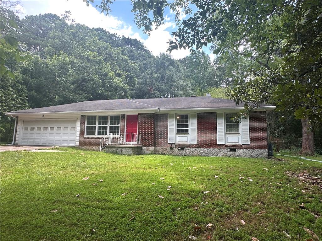Are you looking for a well built, good sized, one level 3 Bed/2 Bath, 2100 Square Foot Brick Ranch, sitting on 3/4 acre flat fenced in private yard with a huge outbuilding and room for lots more located in one of the most desirable areas of Unincoporated Dekalb directly across the street from Little Creek Horse Farm and Park? Well look no further because you found it and this will not last long. Priced to move fast, come upgrade these Bathrooms, Kitchen and Backyard into your dream house/Oasis. The options and opportunities are endless for this awesome property located right off Hwy 78 and inside the perimeter. If you are looking for a little more Square footage and a nice sized Private lot along with the opportunity to get some sweat equity then this property is perfect for you. Come see this hidden gem.