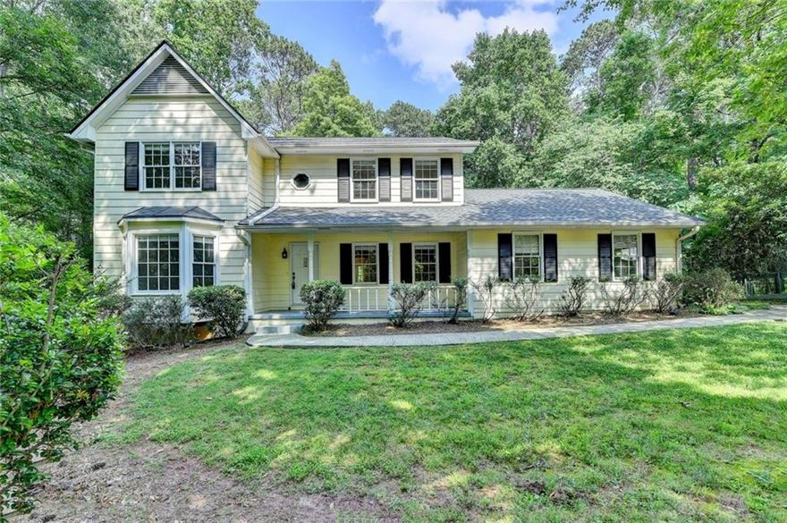 Recently renovated 4BR/2.5BA home with 2 car side entry garage and rocking chair front porch great for first time buyers, investors and owner occupants.  Fresh neutral interior paint. Newer roof and carpet. Hardwoods in entry and dining room.  New granite counters in kitchen and upstairs bath vanities. Tiled kitchen features newer SS appliances, pantry, bayed breakfast area with tile floors and view to double deck in backyard. Fireside family room boasts new lighted ceiling fan and double french doors that open to the deck and backyard. Separate laundry room, powder room and formal living room complete the main level.  Primary bedroom features walk in closet and ensuite bathroom. 3 more bedrooms, all with lighted ceiling fans, and a full guest bathroom complete the upper level. Enjoy your morning coffee, family barbecue or entertaining guests in on the huge double decks overlooking a private wooded nature preserve style backyard and watch the deer go by. Basketball goal on driveway included. Newer garage door and extra storage space in oversized two car garage. Just minutes to GA 400, North Point Mall, Avalon, Downtown Alpharetta District and many other popular shopping, dining, park and recreation areas including popular Newtown Park right across the street from this community. Great schools too! NO HOA! This one is sure to go quickly. 
Below is just standard safety language for all of our marketing: Visitor acknowledges that in any house in yard there may be conditions that could injure a visitor if the visitor is not careful. Visitor agrees on behalf of visitor, and all minors accompanying visitor to 1. Use caution when viewing the property 2. Carefully watch where visitor is walking. 3. Hold onto handrails on stairs at all times 4. Have children walk with you and be under your control. 5. Do not climb on anything and 6. Avoid any obviously hazardous behavior or condition. We want you to be safe.