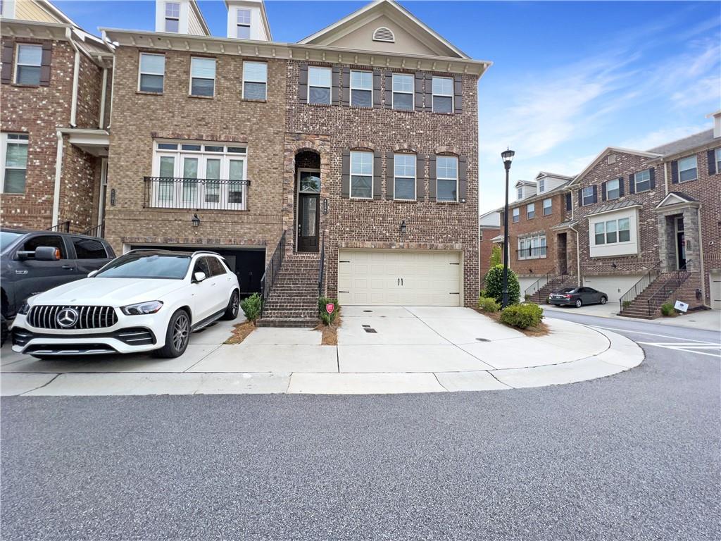 Don't miss out on this newer construction END UNIT Townhouse, available immediately. The main level features a spacious living room with included large screen TV mounted over the fireplace. Gorgeous hardwood floors throughout. The open concept kitchen features stainless appliances, gas cooktop, granite counters, farmhouse sink and spacious pantry. A large, elevated deck is just past the eat-in kitchen area with great views of the neighborhood. This gated community also includes a clubhouse and pool.
The third floor features the master bedroom with attached bathroom, complete with double vanity, large shower with double shower heads, and walk in closet. Down the hall is a full guest bathroom plus two guest bedrooms. The laundry room is conveniently located next to the Master Bedroom.
The basement provides access to the two-car garage, a full bathroom, and oversized bedroom which can also be an office or kids play area. This level also has a walk-out patio shaded by the upper deck.
WALK TO Georgetown Recreation Club, Two Bridges Park, and Endeavor Montessori School! Convenient location to Perimeter Mall, I-285, GA-400, Marist, Murphy Candler Park and more!
We are pet friendly! Ask us about our industry-leading Resident Benefits Program including credit boost, identity theft protection, 24/7 maintenance hotline, air filter delivery, utility concierge, resident liability insurance and more!