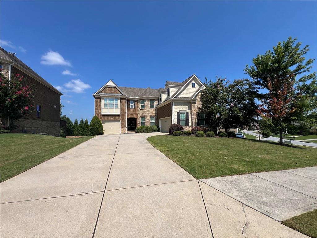 Sought after beautiful single family house in top Lambert High School cluster. Situated right next to Settles Bridge Elementary School and Riverwatch Middle School, literally walking distance to both schools and 5 minutes driving to Lambert High. If you have a student, this is the perfect house to live in years.
5 bedrooms 4 full baths, 3 car garage, two story foyer, spacious rooms with extra large closets and lots of storage, unfinished basement, lots of natural lights and unravel scenery. Call now to check it out!