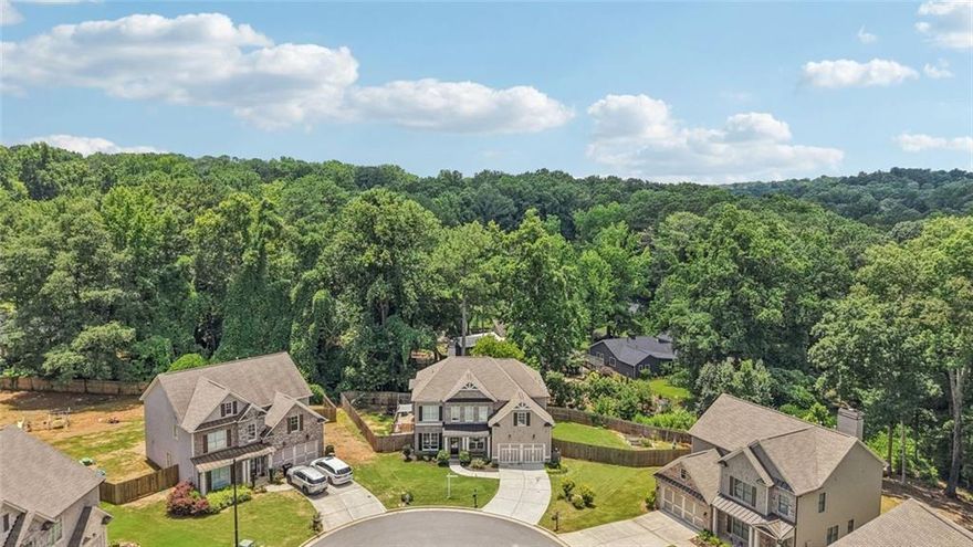 Fantastic Opportunity to Live in the Sought After Hawkins Place Subdivision. This 5BR/3.5 Bath Home is well Appointed with Numerous Upgrades, Bonus Room, Large Fenced Backyard, Covered Patio for Relaxing, Oversized Deck for Entertaining and Sits on a Private Culdesac Lot! This Bright Open Floorplan Has Gorgeous Wide Plank Hardwood Floors Throughout Main. Chef's Kitchen w/Custom White Cabinets, Granite Countertops, Tiled Backsplash, All Stainless Steel Appliances, Built-in Microwave, Dual Ovens, Separate Gas Cooktop, Island, Breakfast Bar, Pendant Lighting, Walk-in Pantry and Breakfast Area w/Chandelier. Dining Room w/Tray Ceiling, Wainscoting, Chandelier and Butler's Pantry. Separate Den/Office Area on Main w/Crown Molding. Family Room with Custom Fireplace, Ceiling Fan and Wonderful Backyard Views. Covered Patio is Perfect for Reading and Relaxing or Entertain on the Oversized Deck Overlooking the Private Fenced Backyard. Large Master Suite Has Tray Ceiling and Fan. Master Spa Has Gorgeous Tiled Floor, Custom Dual Vanity w/Quartz Countertops, Custom Fixtures, Oversized Garden Tub, Subway Tiled Shower and Huge Walk-in Master Closet. Huge Bonus Room Up Makes a Wonderful Rec/Media Room or Potential 5th Bedroom! 3 Spacious Secondary Bedrooms Up, One w/Private Bath and Two Others That Share a Jack-n-Jill! This Home Has Lots of Character and Curbside Appeal! Buyer will Receive a $3,500 Lender Credit with preferred lender JT Trial-Certainty Home Lending