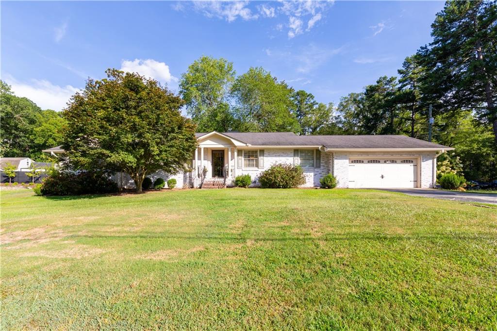 Fall in love with this beautifully updated 3-bedroom, 3-bath home located just steps from the heart of Downtown Monroe and Childers Park. NEW ROOF to be installed on 8/2 with an assumable warranty for the new homeowner-offering added peace of mind and long-term value.
Whether you're headed to a local festival, dining at your favorite cafe, or enjoying a relaxing walk, you'll appreciate everything this golf cart-friendly community has to offer. Inside, you'll find gleaming hardwood floors throughout, a versatile bonus space perfect for a home office or playroom, and stylishly upgraded bathrooms featuring granite countertops. The open and airy layout offers modern touches and a cozy feel that's perfect for both everyday living and entertaining. Enjoy peaceful mornings on the screened-in porch or host friends and family in the spacious backyard-complete with a 12x16 shed that stays with the home! A double car garage adds extra storage and convenience. Located in the highly sought-after Walnut Grove School District, known for some of Monroe's best schools, this move-in ready gem offers the perfect blend of charm, function, and location. Don't miss this rare opportunity to own a beautifully updated home with small-town charm and big-time convenience.