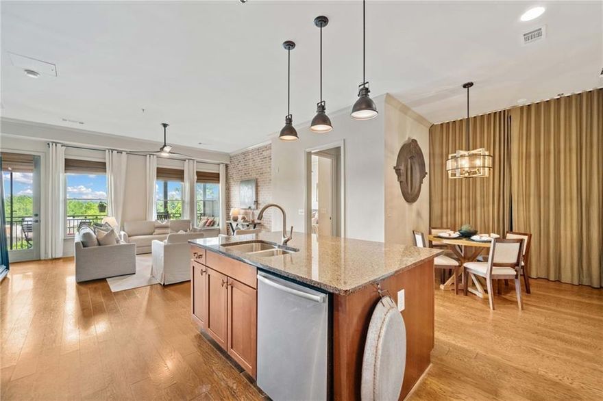 Come live the lifestyle you deserve in Downtown Woodstock! Welcome to this stunning 2-bedroom, 2-bathroom condo in the highly sought-after Chambers Street building in the vibrant core of Downtown Woodstock -- ranked as one of Georgia’s best places to live! This beautifully appointed condo features soaring ceilings; tons of natural light; a full suite of stainless steel kitchen appliances; new HVAC; and custom feature walls that add warmth and character to the open-concept great room and dining area. The views from the balcony patio are absolutely to die for, and will serve as the perfect outldoor living space you can retreat to even while living in the heart of it all. Whether it's morning coffee; a mid-day work-from-home conference call; or an evening cocktail admiring the beautiful views, this patio may end up being your absolute avorite space of this gorgeous home. Enjoy an easy & convenient lifestyle with restaurants, coffee shops, brewries, boutique shopping, and live music venues just steps from your front door. Tucked away behind the building, you’ll also find a private amphitheater, serene park space, and cozy firepits — plus access to the residents-only, resort-style pool. The condo includes two deeded parking spaces in the gated parking lot, providing ultimate convenience. Top-rated Cherokee County schools, with easy access to I-575, Woodstock Outlets, wineries, and scenic trails. The brand-new Downtown Woodstock parking deck makes it easy for your guests to visit. Whether you're looking for a full-time home, second property, or an excellent rental investment, this condo checks every box. Schedule your private tour today and experience everything Downtown Woodstock living has to offer!