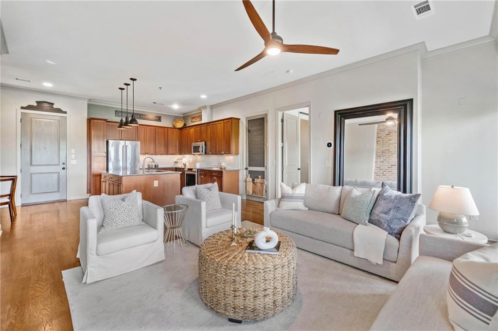 Come live the lifestyle you deserve in Downtown Woodstock! Welcome to this stunning 2-bedroom, 2-bathroom condo in the highly sought-after Chambers Street building in the vibrant core of Downtown Woodstock -- ranked as one of Georgia’s best places to live! This beautifully appointed condo features soaring ceilings; tons of natural light; a full suite of stainless steel kitchen appliances; new HVAC; and custom feature walls that add warmth and character to the open-concept great room and dining area. The views from the balcony patio are absolutely to die for, and will serve as the perfect outldoor living space you can retreat to even while living in the heart of it all. Whether it's morning coffee; a mid-day work-from-home conference call; or an evening cocktail admiring the beautiful views, this patio may end up being your absolute avorite space of this gorgeous home. Enjoy an easy & convenient lifestyle with restaurants, coffee shops, brewries, boutique shopping, and live music venues just steps from your front door. Tucked away behind the building, you’ll also find a private amphitheater, serene park space, and cozy firepits — plus access to the residents-only, resort-style pool. The condo includes two deeded parking spaces in the gated parking lot, providing ultimate convenience. Top-rated Cherokee County schools, with easy access to I-575, Woodstock Outlets, wineries, and scenic trails. The brand-new Downtown Woodstock parking deck makes it easy for your guests to visit. Whether you're looking for a full-time home, second property, or an excellent rental investment, this condo checks every box. Schedule your private tour today and experience everything Downtown Woodstock living has to offer!