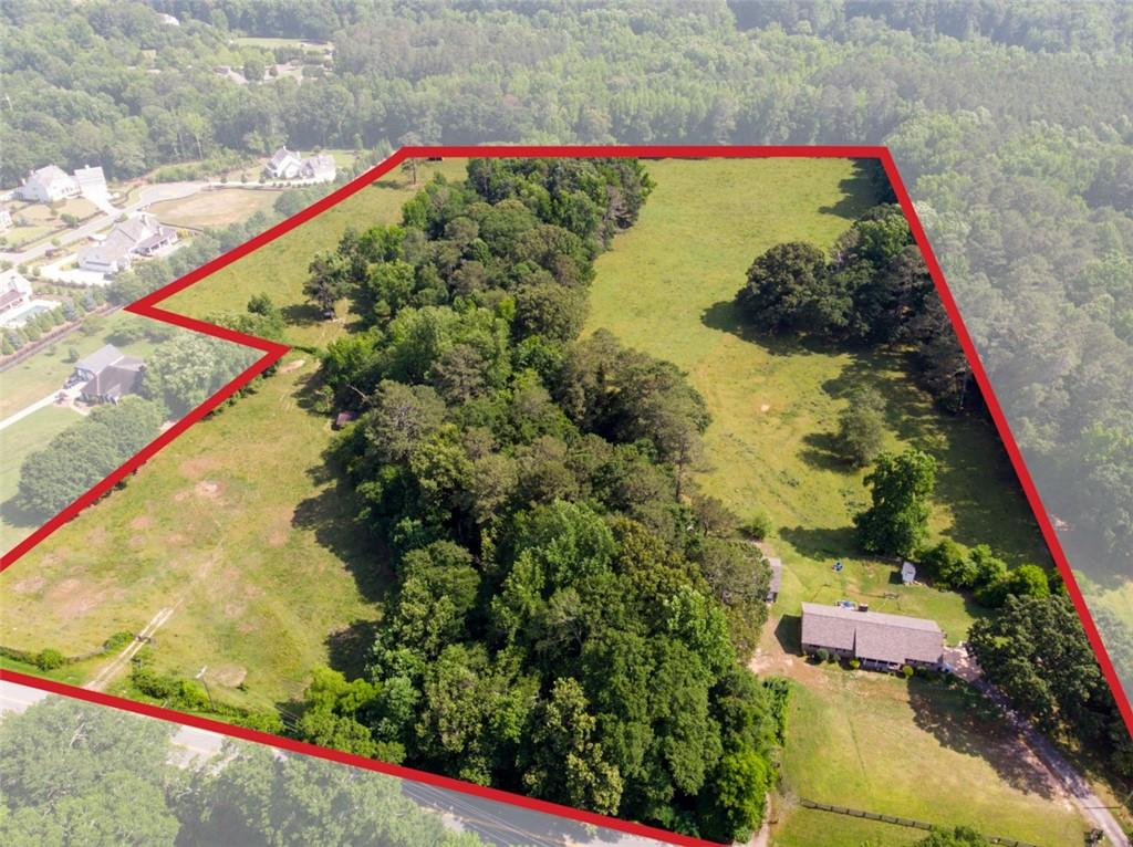 Location, Location, Location! Welcome to an unparalleled opportunity to acquire 22.4 acres of immaculate, LEVEL land boasting expansive clear areas, nestled in the heart of Milton, GA.
Close enough to enjoy all the excitement Milton has to offer, yet sprawling enough to provide a secluded retreat. This property offers the perfect balance between accessibility and privacy, making it an ideal haven for your dream estate. This exceptional parcel presents endless possibilities for your envisioned estate, whether it be an expansive equestrian retreat, a custom hobby farm, or a serene oasis enriched by the meandering stream. Situated in an esteemed locale, this property offers a tranquil sanctuary while remaining conveniently proximate to an array of amenities, encompassing parks and retail destinations.
Imagine crafting a grandiose equestrian estate amidst the idyllic scenery, with sprawling pastures, state-of-the-art equestrian facilities, and the soothing presence of a babbling stream. Alternatively, envision cultivating your own hobby farm, complete with lush gardens, orchards, and space for livestock, all nourished by the natural water source that gracefully winds through the property.
Milton is distinguished for its exceptional schools, vibrant equestrian scene, and steadfast commitment to preserving its natural splendor, ensuring robust demand and escalating property valuations. Seize this rare opportunity to claim a premier slice of real estate tailor-made for your dream equestrian estate, hobby farm, or private sanctuary.
Schedule your exclusive tour today and embark on an exploration of the boundless possibilities awaiting you.
