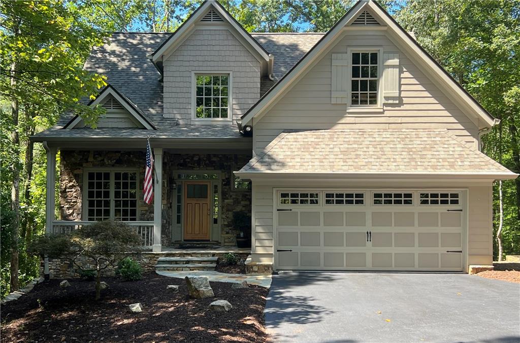 Immaculate 5-bedroom, 3.5-bath home in Big Canoe, Atlanta’s premier mountain community. This move-in ready property has been maintained with exceptional care and sits on a level lot with Disharoon Creek at the back and a path that connects directly to the Jeep Trail. Grid-free rear windows provide wide open views and the soothing sound of the creek. The home features a spacious floor plan, circular drive with ample parking, and a 2-car garage.
This property also includes a versatile in-law suite, with a screened porch and wet bar, perfect for entertaining. Additional conveniences include a second laundry area and ample storage throughout.
Major improvements include a new roof in 2024, two new AC units in 2022 with annual servicing on all three systems, septic inspection and service in 2021, and kitchen upgrades with a gas stove and dishwasher added in 2022. Additional updates include interior paint, upgraded baths, refinished front door, professional window cleaning, annual exterior pressure washing, and new natural stonework and landscaping.
Big Canoe offers an unmatched lifestyle surrounded by 8,000 acres of lush national forest, with over one-third dedicated to wildlife areas and parks, recognized by Georgia Audubon as a nature preserve. Residents enjoy golf, tennis, pickleball, bocce ball, lakes, 25 miles of scenic hiking trails, multiple dog parks, playgrounds, and a 13,000-square-foot Wellness Center, with flexible membership or pay-as-you-go access to amenities. Located just a short distance to the newly renovated Beach Club and village, this home combines privacy, comfort, and convenience, ready for its next owner.