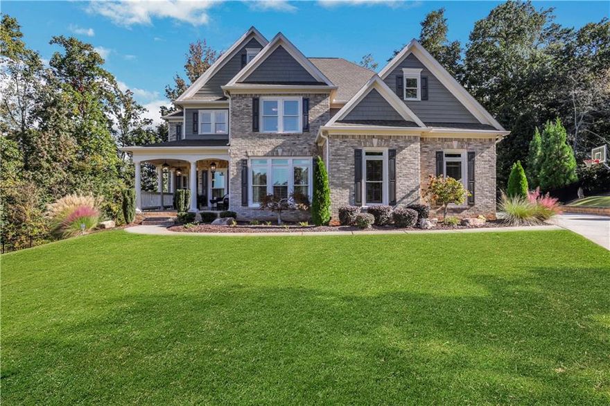 Tucked away on a peaceful cul-de-sac, this meticulously maintained 3-sides brick home stands out with its timeless curb appeal, inviting front porch, and incredible outdoor oasis. Step inside to rich hardwood floors, soaring ceilings, and walls of windows that fill the home with natural light. The main level offers a private office—perfect for working from home—and an elegant dining room ideal for hosting family and friends. At the heart of the home, the updated kitchen impresses with quartz countertops, high-end stainless steel appliances, and an extended island that opens seamlessly to the two-story great room. It’s the kind of space that makes both everyday living and entertaining feel effortless. Upstairs, the spacious primary suite is a true retreat with a spa-inspired bath, soaking tub, oversized glass shower, dual vanities, and a large walk-in closet. Three additional bedrooms—one with a private ensuite and two sharing a Jack-and-Jill bath—offer comfort and flexibility for everyone. Also upstairs you'll find the laundry room. The fully finished basement is designed for fun and function with a game room, full kitchen, bedroom suite, ample storage, and the best home theater on the market—complete with stadium seating. Step outside and enjoy your own private backyard oasis with sparkling pool, waterfall feature, oversized hot tub, screened-in deck, and side porch. A tankless water heater, 3 car side-entry garage and thoughtful updates throughout make this home as efficient as it is beautiful. Located in Ashebrooke, one of the area’s most vibrant and social communities, known for holiday celebrations, pool parties, tennis leagues, and neighborhood gatherings. Just minutes from Big Creek Greenway, Cumming City Center, GA 400, shopping, dining, and top-rated West Forsyth schools. More than a house—this is a place where life slows down, laughter comes easily, and memories are made to last.