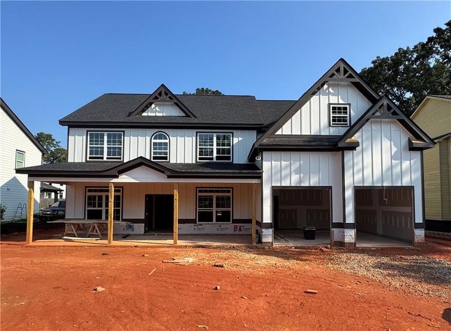 Welcome to this beautiful new construction two-story Craftsman-style home, thoughtfully designed with both comfort and functionality in mind. Featuring 5 spacious bedrooms and 4 full bathrooms, including a private guest suite on the main level, this home offers plenty of room for family and guests. Enjoy multiple living spaces with a separate dining room, formal living room, and a cozy family room on the main floor-perfect for everyday living and entertaining. A dedicated theater room on the second floor provides the ideal space for movie nights or relaxing weekends. Step outside to unwind on the covered back porch with privacy fence in backyard or the inviting rocking chair front porch. Located just minutes from shopping, dining, and everyday conveniences, this home offers the perfect blend of style, space, and location.