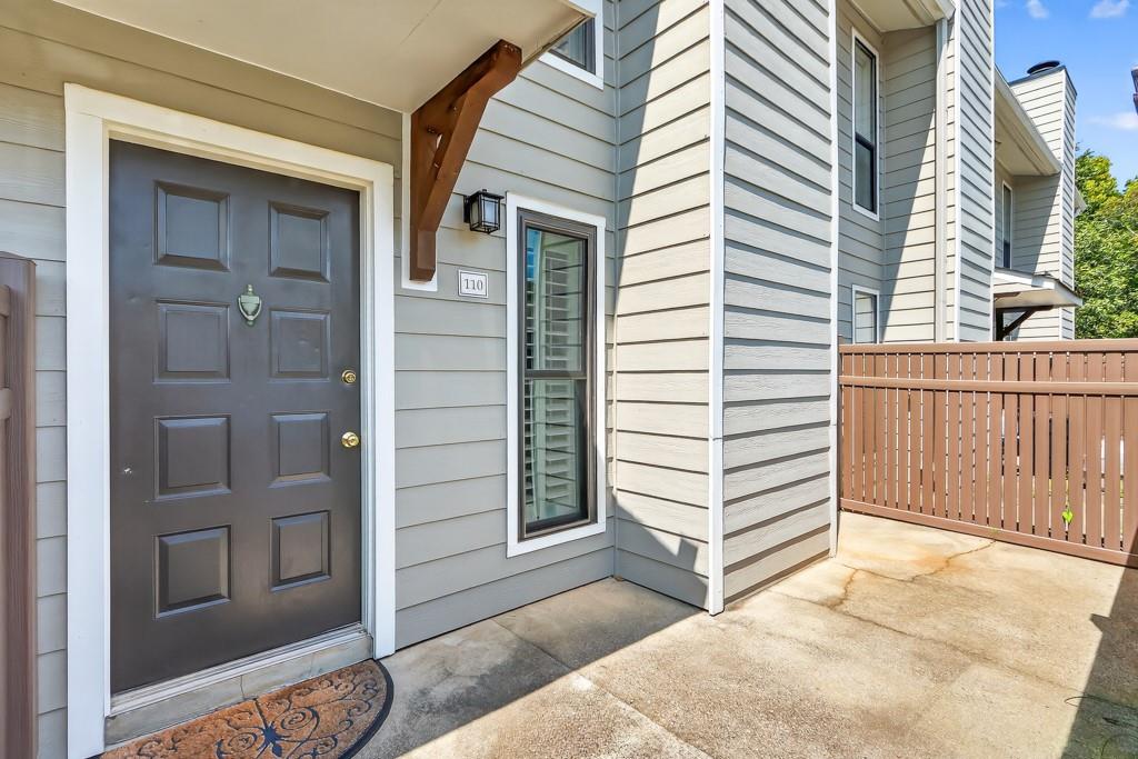 Welcome to this beautifully maintained 1-bedroom, 1.5-bath condo in one of East Cobb’s most sought-after neighborhoods. Step inside and immediately feel the warmth of the open-concept living area, complete with hardwood floors, soaring ceilings, and a cozy fireplace—perfect for relaxing or entertaining. The kitchen is bright and functional, featuring crisp white cabinetry, stainless steel appliances, and plenty of counter space for cooking or gathering with friends.
The spacious bedroom offers a private en-suite bathroom and a walk-in closet, while an additional half bath provides convenience for guests and everyday living. Outside, enjoy your own private front courtyard—a peaceful retreat for morning coffee or evening unwinding.
This home also offers community amenities designed for both relaxation and recreation, including a sparkling swimming pool and well-kept tennis courts. All of this is located just a short stroll from shopping, dining, and local conveniences, with easy access to major highways and, of course, the award-winning Walton High School district. Combining comfort, style, and an unbeatable East Cobb location, this condo is a rare opportunity to own in a community that truly feels like home.