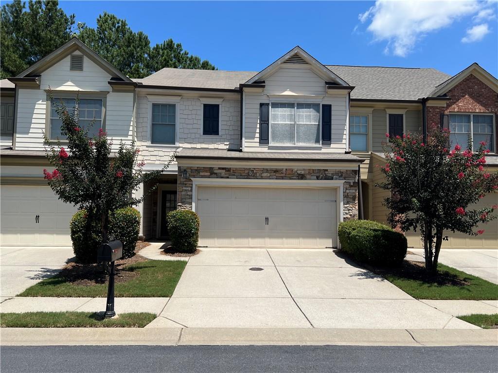 Like-new ** Gorgeous Alpharetta location ** 3-2.5 home in highly-desired community ** Beautiful stone/brick Front ** Maintenance-free exterior ** 2-car garage ** Upgrades galore: Hardwood floor on entire main level ** Tiled bathrooms ** Granite counter-tops ** Lovely cabinets ** All stainless steel appliances ** Decorator's colors ** Freshly painted for the whole interior ** Pleasant light fixtures ** Wooded Idyllic and Tranquil backyard - perfect for cook-out ** Professionally cleaned ** Refrigerator, Washer and Dryer provided ** Move-in ready ** Tennis / Swimming Community ** Great award-winning South Forsyth schools ** Close to corporate headquarters, & GA 400, and convenient to shopping & all amenities! * Good credit is a must!