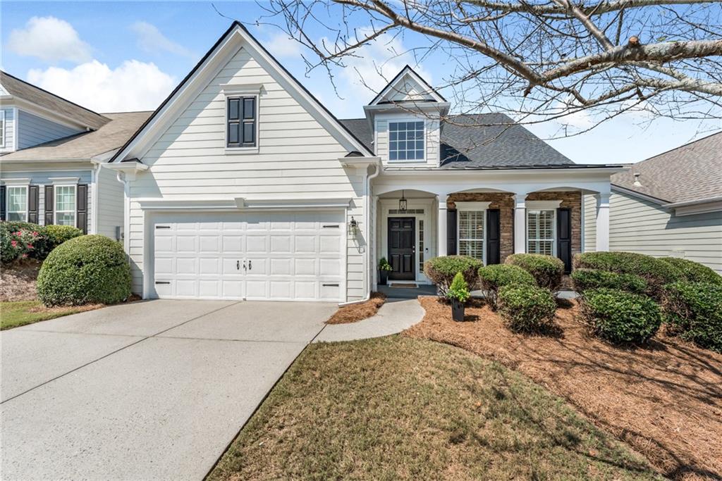 Elegantly Updated Home with Superb Craftsmanship and Attention to Details. From the BRAND NEW ROOF to the highly durable LVP flooring, this property exudes QUALITY and COMFORT from top to bottom! Situated on a LEVEL lot near the cul-de-sac, everything is EASY and PEACEFUL at 1555 Diplomat Drive. Warm, neutral tones on the walls and flooring allow the custom cabinetry in the kitchen and bathrooms to subtly pop, creating WOW FACTORS that will not go unnoticed. To boot, there's lots of extra icing on this cake: QUARTZ counters, soft closing drawers and doors and ceiling height cabinets in the kitchen...all of which effortlessly enhance the beauty and functionality of this exceptional home. CUSTOM millwork and a double tiered chandelier in the two story living room gracefully elevate the look and feel of the central gathering space. Glass sliders provide easy access to the delightfully ENCLOSED porch that overlooks LUSH emerald grass and evergreens in the spacious backyard. The light-filled primary suite features a tray ceiling, gorgeous chandelier, plantation shutters and an all new LUXURY bathroom. Delight in the custom, oversized shower with FRAMELESS glass surround, designer tile, modern double vanity with high end lighting and mirrors, plus a water closet and a large walk-in closet. A second bedroom and full bathroom on the main level can also serve as an office or convenient flex space. The generously proportioned upper level is designed for multi-functional purposes: with a large bedroom, updated full bathroom and a gigantic loft space, it can serve as a guest suite, entertainment space, office space or anything you can envision. Peachtree Court residents enjoy the benefits of YARD MAINTENANCE, year-round social activities at the clubhouse, a pool and community greenspace. With its central location, it's mere minutes to: GA 400, The Collection, restaurants, retail, medical, Halcyon, Lake Lanier and more. ABSOLUTELY THE MOST BANG FOR THE BUCK in South Forsyth County. Come make it yours today.