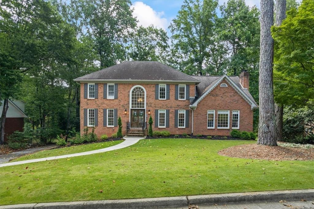 Welcome home to sought after River Station neighborhood in Peachtree Corners. This renovated 5 bedroom, 4 bath home doesn't spare any details. The foyer is welcoming with a designated office space to your left, an warm living space complete with fireplace and built in floor to ceiling book cases. This entertainers dream kitchen has SS appliances, gas range, quartz countertops and more! You don't want to miss the coffee bar and butler's pantry. Off the kitchen you'll find an adorning sun room leading to the expansive back porch overlooking the private back yard. On the upper level, you'll find three bedrooms and two full baths. The master bedroom boasts ample space with a reading nook. The bathroom shower is a must-see and is equipped with three shower heads and soaking tub, oversized walk in closet with custom closet system! The full daylight basement has been finished with elegant touches to the in-law suite. With a secondary kitchen, bedroom, bath room, living space and sun room, you'll want for nothing! Swim & tennis community with river access & more!