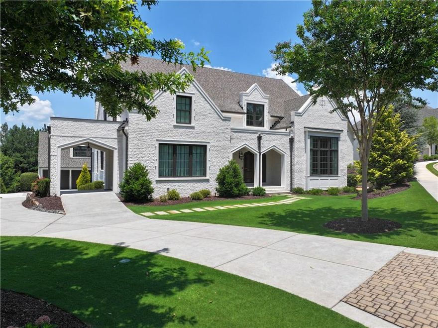 Welcome to a one-of-a-kind custom estate perched on the largest homesite in the exclusive Cottages section of The Manor Golf & Country Club. This timelessly elegant home sits directly on the first fairway, just steps from the driving range, putting green, and the Clubhouse—accessible via your own private stone stairway leading to the first tee.
Meticulously designed for both sophistication and function, this residence boasts an exquisite crafted main-level patio, featuring a resort-style pool, spa, and firepit with panoramic fairway views. The outdoor living space is elevated by a full gourmet grilling area complete with a high-end gas grill, Big Green Egg, and built-in beverage center—perfect for relaxing or entertaining in style.
Inside, a grand 2-story foyer welcomes you with a stunning curved staircase, setting the tone for the exceptional craftsmanship throughout. The main level includes a vaulted owner’s suite that is both serene and luxurious, with spa-like finishes and his-and-her custom closets.
The chef’s kitchen is a showpiece, outfitted with a large island, breakfast bar, top-tier appliances, and walk-in pantry—all opening seamlessly to the living and dining spaces. A custom sunroom with hand-wrought iron windows opens directly to the patio, creating a breathtaking indoor-outdoor flow.
Upstairs, three generously sized ensuite bedrooms each offer walk-in closets and refined finishes. A separate full carriage house suite—complete with its own kitchen and living area—provides the perfect retreat for guests, in-laws, or a private office.
The terrace level continues to impress with a game room, fully equipped gym, and sauna, as well as over 1,100 square feet of unfinished space ready for expansion or storage. Additional features include a spacious mudroom, laundry room, and a three-car garage.
From your morning coffee on the putting green to evenings at the Club or private tennis courts, this property offers a lifestyle unmatched in the Atlanta luxury market. Don’t miss this rare opportunity to own one of The Manor’s most distinguished homes.
The Manor is a gated community and has unparalleled amenities including indoor and outdoor pools, indoor and outdoor tennis courts, fitness center, two Clubhouses, 18-hole Tom Watson designed golf course, and sidewalks throughout. Great school district. Close to shopping and easy access to GA 400.