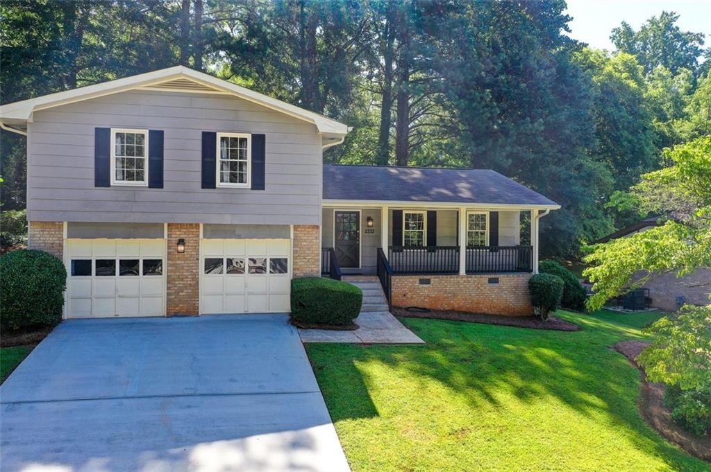 Modern, flowing updated home in super-convenient, "at the perimeter" Worthington Valley. The spacious and open floor plan offers easy living upstairs in the bedrooms plus indoor-outdoor enjoyment on the main floor, the downstairs den and outward to the rear patio. The kitchen features stainless steel appliances. The bathrooms have beautiful tile work. There are 4 generously sized bedrooms, and the primary suite is largest with it's own bathroom suite. The backyard is private and the owner installed a gazebo over the rear patio to enable entertaining outside even if the weather isn't favorable. The front porch is large enough for chilling with family and neighbors and this idyllic, woodland neighborhood is super-convenient with 3 streets that access Snapfinger Road and from there, easy access to Atlanta westward, Decatur northward, Lithonia eastward and Ellenwood southward.