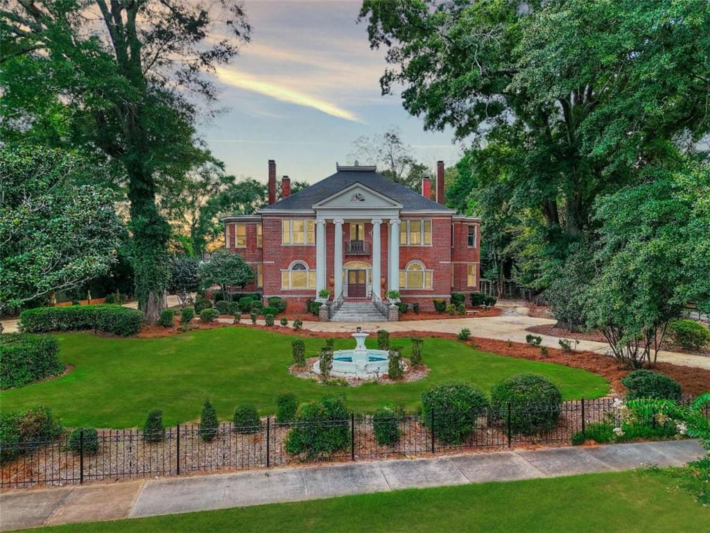 This home is formally known as Regency Hall. Originally constructed in 1890 this home was built to stand the test of time with over 18 inch think walls and 4 sided brick. Located just 0.4 miles to the Covington Square and next door The Twelve Oaks Home also known as the Vampire Diaries House it is hard to miss this home at 2204 Monticello. This home offers southern charm with a touch modern updates throughout. Make this home your own personal residence or convert it into a bed and breakfast, zoning already approved. The home has 5 bedrooms and 6 bathrooms with hardwoods throughout. Be sure to check the 3D tour and 2D schematic online. There is a guest bedroom and bathroom on the main level. The master and other 3 bedrooms and 4 baths are upstairs. The kitchen has a natural gas oven/stove with a commercial grade vent hood along with stainless steel appliances and a large kitchen island. A formal ballroom was added to the rear portion on the home. It makes a great space for entertaining guest with 15 ft ceilings and a custom bar that is included with the sale of the home. There are over 10 antique furniture items, valued at over $30,000 that will be included in the sale of the home at no charge to the buyer. Don't forget to check out the backyard that has a pool, outdoor kitchen, and garden area. This is a must see home! For more information and history on this home call today to schedule a tour. Take a brochure when visiting that details the history and updates to the home. Do not enter property without a scheduled appointment. BRING ALL OFFERS!