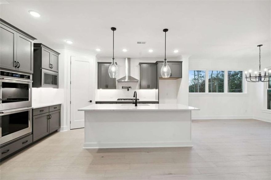 Limited-Time Offer: Purchase a select Quick Move-in Home in Ellis and enjoy up to $80,000 in home incentives! Connect with our sales consultants for full details. This incredible promotion is available now through November 15, 2025 — don’t miss your chance to own luxury at an exceptional value. Step into elevated living with The Ransdall at Ellis — a home that blends luxury, versatility, and natural beauty. Sun-drenched interiors and open-concept design create a welcoming atmosphere, perfect for entertaining or relaxing. The gourmet kitchen is a chef’s dream, featuring premium KitchenAid appliances, double oven, 5-burner cooktop, pot-filler, and vent hood, all framed by serene views of lush greenery.
Enjoy seamless indoor-outdoor living with a screened porch and oversized deck overlooking treetops and natural landscapes. The breakfast area offers a daily connection to nature, while the flexible study and upstairs retreat provide space for work, creativity, or play.
The Owner’s Retreat is a private sanctuary with a spa-inspired bathroom, super shower, and a deluxe walk-in closet. Three additional bedrooms — including a spacious guest suite on the main level — offer comfort and privacy for family and visitors.
Located in desirable West Cobb, Ellis offers rare tranquility with two private walking trails and sweeping views. Community amenities include a pool, pickleball and tennis courts, clubhouse, and twin lakes for fishing and canoeing — all designed to support an active and social lifestyle while preserving privacy. 
Just minutes from Marietta Square, Kennesaw Mountain, and top private schools like Mount Paran Christian, The Walker School, and North Cobb Christian. Everyday essentials like Whole Foods, Publix, Target, and Kennestone Hospital are close by, making life convenient and connected. This is more than a home — it’s a statement of refined living, where architectural elegance, modern convenience, and natural serenity converge.