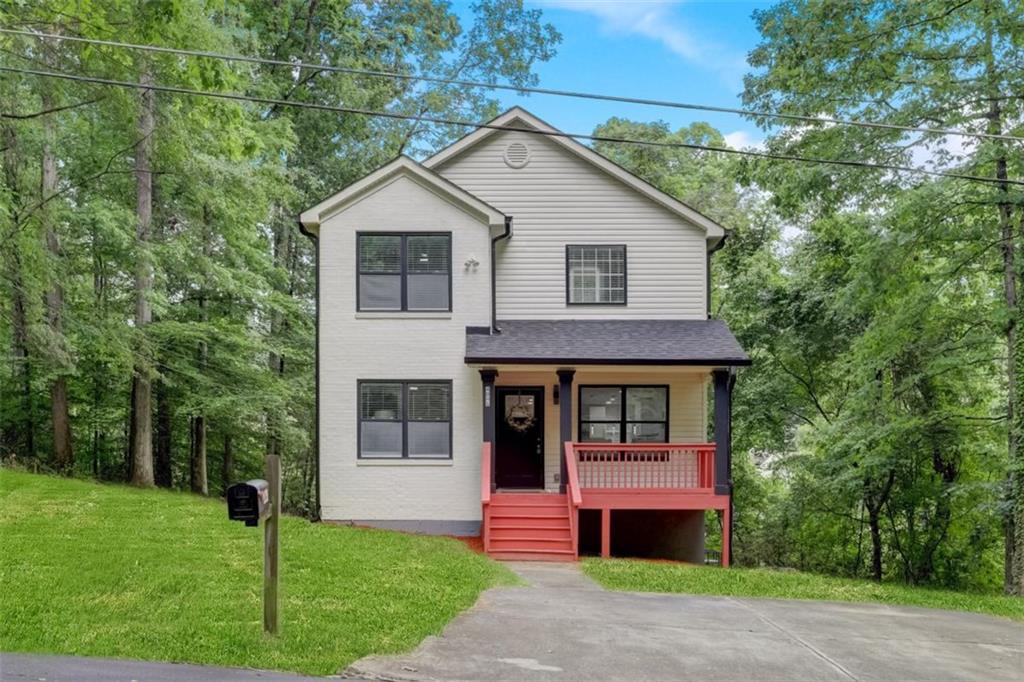 **Home qualifies for up to $25,000 "no repayment grant" as well as 100% financing with preferred lender.** Welcome to this fully renovated luxury residence offering 4 spacious bedrooms and 2.5 designer baths. This move-in ready home blends timeless elegance with modern sophistication. Enjoy real hardwood floors on the main level, an inviting living room with fireplace, and an open-concept layout perfect for entertaining. The chef's kitchen features white shaker cabinets, granite waterfall countertops, and stainless steel appliances. The luxurious primary suite includes a spa-like bathroom designed to impress. Additional bedrooms provide flexible space for family, guests, or a home office. Conveniently located minutes from I-285, I-20, Hartsfield-Jackson Airport, Downtown Atlanta, shopping, and dining. No HOA-ideal for a primary residence or Airbnb/investment property. Don't miss this exceptional opportunity to own a beautifully upgraded home in a prime location.