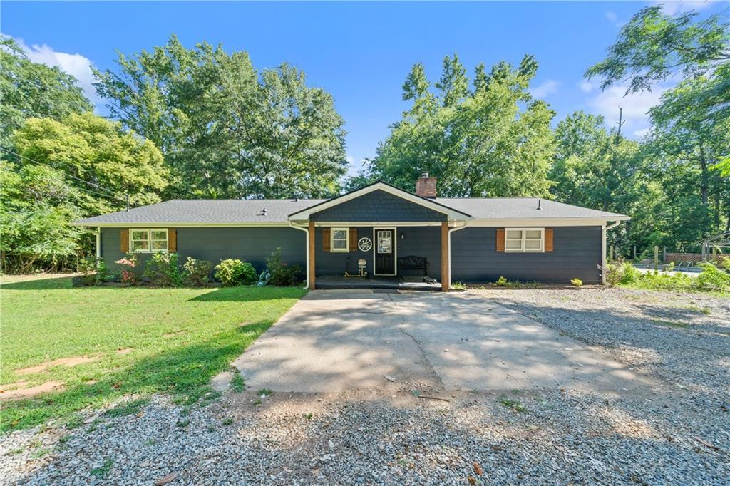 Welcome to this beautifully renovated Lake Sinclair waterfront ranch, where modern style meets casual lakefront charm.Offering serene, one-level living, this 4-bedroom, 3-bathroom home spans 2,502 sq ft and is thoughtfully designed to maximize lake views and seamless indoor-outdoor living. Step into the spacious living room, where sliding glass doors invite natural light and showcases stunning views of the water. The space is anchored by a cozy wood-burning fireplace-perfect for gathering with family and friends. The gourmet kitchen features abundant counter space, sleek stainless steel appliances, and modern finishes that will delight any home chef. The primary suite offers a private retreat with a generous walk-in closet, a luxurious walk-in tile shower, and dual vanities. Three additional bedrooms and two full baths provide ample space for guests, a home office, or a growing family. Outside, enjoy the convenience of a single-stall boathouse-ideal for lakeside living. Both the main home and boathouse feature brand new roofs, fresh interior and exterior paint, a new tankless water heater, and a new AC unit for year-round comfort. Furnishings are negotiable. This turnkey property is ready for you to move in and start enjoying the lake lifestyle. Schedule your private showing today-this one won't last long!
Hide