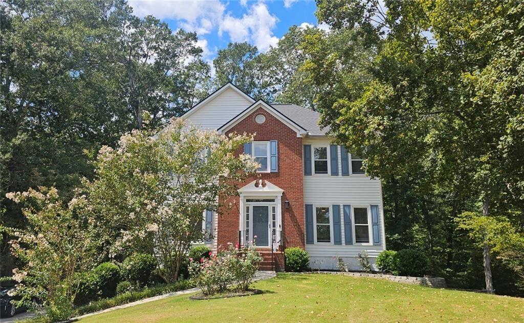 Beautifully Renovated Home on Private Wooded Cul-de-Sac 1/2 Acre Lot in Top Cobb County School District. Welcome to your dream retreat! BRAND NEW ROOF AND HOT WATER HEATER. This stunning, fully renovated home is nestled on a serene, wooded cul-de-sac lot in one of Cobb County’s most sought-after school districts. Featuring an open floor plan and a spacious finished basement, this home is ideal for comfortable everyday living and effortless entertaining. Step inside to find brand-new flooring, fresh interior paint, and updated lighting and ceiling fans throughout. The bright, modern kitchen boasts white cabinetry, sleek granite countertops, stainless steel appliances and views into the living areas—perfect for both cooking and connecting. The remodeled, fully tiled bathrooms with quartz countertops add a touch of luxury, and no carpet means easy maintenance. You'll love the spacious great room and cozy sitting area with a fireplace, as well as the separate formal dining room, ideal for hosting guests. The oversized owner’s suite and generously sized secondary bedrooms offer plenty of space for everyone. Relax and unwind on the custom-built, oversized deck—partially covered and perfect for year-round enjoyment—overlooking a large, private fenced backyard surrounded by nature (with enough room for a pool). High 9-foot ceilings on the main level and newer insulated vinyl windows enhance comfort and efficiency. Located in a friendly swim/playground community just minutes from The Avenue West Cobb, Barrett Parkway, dining, shopping, and more—this home combines privacy, beauty, and convenience. Location, Lifestyle, and Luxury—This One Has It All! Must See Inside!
