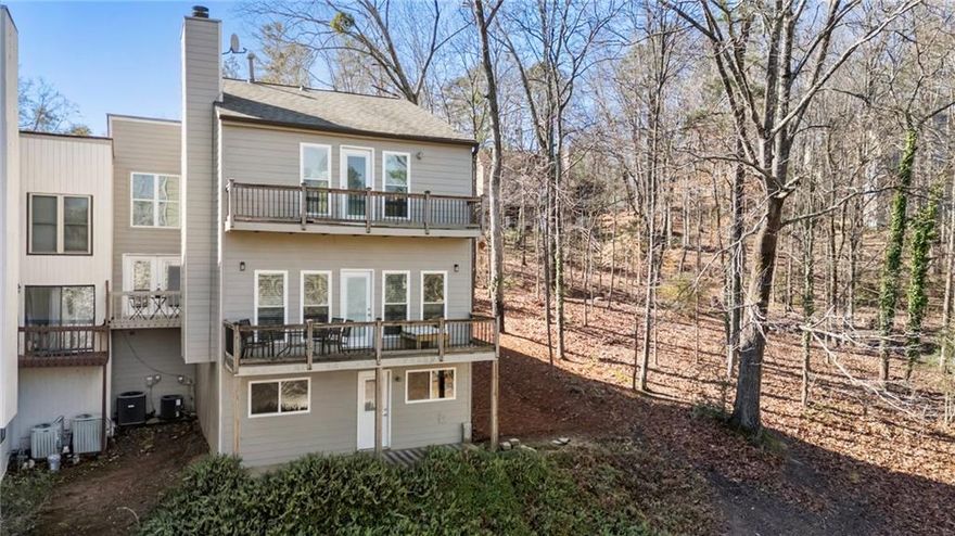 As seen on HGTV! Welcome to this 4 bedroom, 3.5 bathroom END UNIT townhouse nestled in a prime location of Alpharetta just minutes to Downtown Roswell. Once you enter this updated townhouse you will notice the abundance of natural light and the spacious open floor plan. The vibe is fresh and modern yet comfortable living. Recently renovated with new paint, carpet, custom window blinds, NEW HVAC and new bathrooms in primary bedroom and secondary bedroom upstairs. The main level has a well appointed eat in kitchen and a separate dining room that overlooks the large living room with hardwood floors, lots of windows and a gas burning fireplace. Several decks allow for outdoor entertaining or just enjoy a quiet cup of coffee in the morning overlooking the water view. Terrace level has a finished recreation room with ceramic tile throughout, full bathroom and 2 additional bedrooms currently being used as an office and home gym. Terrace has its own entrance making it very accessible for a roommate. There is no shortage of things to do within the community or near by. Enjoy a private 26 acre park along the Chattahoochee for Rivermont Residence, dog park, pool, tennis, clubhouse and near by golfing, shopping and dining in Downtown Roswell, Downtown Alpharetta, Avalon and much more. You're getting so much for the money in this one, don't miss it!