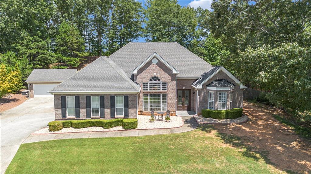 Welcome to 606 Gold Crest Drive, Braselton, GA!
This beautifully updated 3-bedroom, 2-bath brick-front ranch is an absolute showstopper—you’re going to fall in love! Step inside to discover a spacious and inviting floor plan, including an oversized primary suite with a breathtaking bathroom retreat. The luxurious primary bath features separate his-and-hers vanities, a stunning walk-in shower, and a soaking tub perfect for relaxing at the end of the day.
Designed with comfort and privacy in mind, this ranch-style home features a roommate floor plan with two generously sized secondary bedrooms located on the opposite side of the home. The formal dining room is a true centerpiece, ideal for hosting family gatherings and special occasions.
The cozy family room is warm and inviting, highlighted by a redesigned fireplace that adds a modern touch. The kitchen offers a bright breakfast area overlooking your private backyard oasis—complete with a beautiful saltwater pool that’s perfect for entertaining family and friends all year round.
This home is truly move-in ready and full of charm. Don’t miss your chance—this gem won’t stay on the market for long. Thank you for showing!