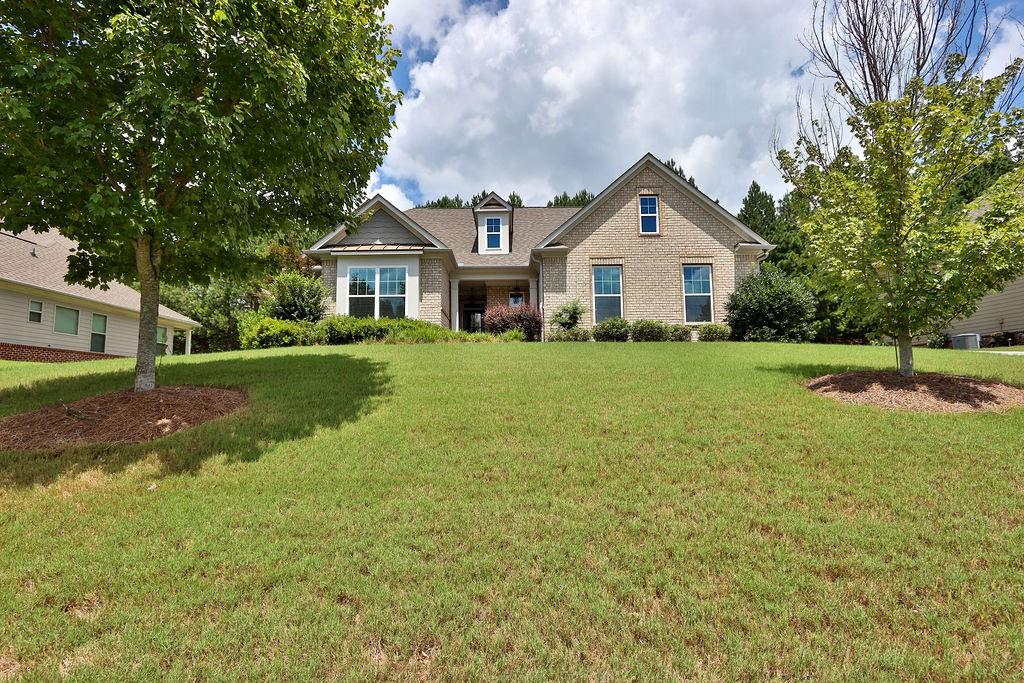 Welcome home to this stunning ranch-style home! This beautiful house features a chef's kitchen with stained cabinets, granite countertops, an island with a breakfast bar, and a dining area. The kitchen overlooks a cozy family room with a gas fireplace.
The master suite is tucked away towards the back of the house for added privacy. Two secondary bedrooms share a Jack and Jill bathroom. The upper level boasts an additional bedroom and full bathroom, perfect for a teen suite, man cave, or entertainment space.
A covered patio with lovely patio furniture remaining completes this Must-See home! River Springs offers a wide range of amenities for residents to enjoy, including a beautiful clubhouse and a swimming pool with a slide. Please Show and Sell!