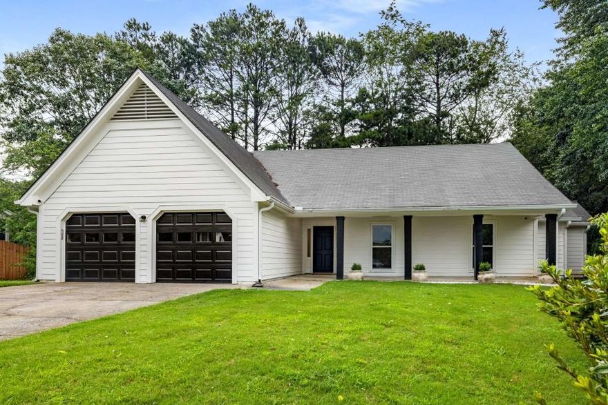Discover this stunning single-story ranch style home, renovated to blend modern elegance with timeless comfort. The expansive family room welcomes you with soaring ceilings and a cozy fireplace, creating an inviting ambiance. Experience the seamless flow of the open-concept layout, where the main level's high ceilings and abundant natural light enhance the sense of space.  The heart of the home is the breathtaking kitchen, showcasing a massive butcher block island, a professional-grade 6-burner gas stove, and a glamorous walk-in pantry offering unparalleled storage. New flooring, lighting, windows, gutters and fresh paint elevate the entire home, while large new windows frame picturesque views and provide effortless access to a private backyard-ideal for alfresco dining and outdoor entertaining.  This versatile home features three generously sized bedrooms, each with ample closet space, plus a flexible fourth room perfect as an additional bedroom, home office, or recreational space. The master bathroom boasts tiled floors, dual vanities, a relaxing bathtub, and a sleek glass-enclosed shower, creating a spa-like retreat.  Impeccably updated and designed for modern living, this home combines style, functionality, and comfort in every detail.  In addition to the incredible interior space, the home sits on a cul-de-sac in Concord Hall which is part of The Caney Creek Recreational Association (CCRA), a private association serving the recreational and social needs of the Highland Park and Concord Hall subdivisions. The homeowners enjoy the use of facilities all year long, including an Olympic sized swimming pool, 3 tennis courts, basketball court, children's playground, and fully equipped clubhouse. There is an active swim team and multiple tennis teams.  In addition to all that the community has to offer, Concord Hall feeds into top rated North Fulton schools, has easy access to GA 400 and is moments away from Halcyon, which features dining options, boutiques, and access to the Big Creek Greenway.