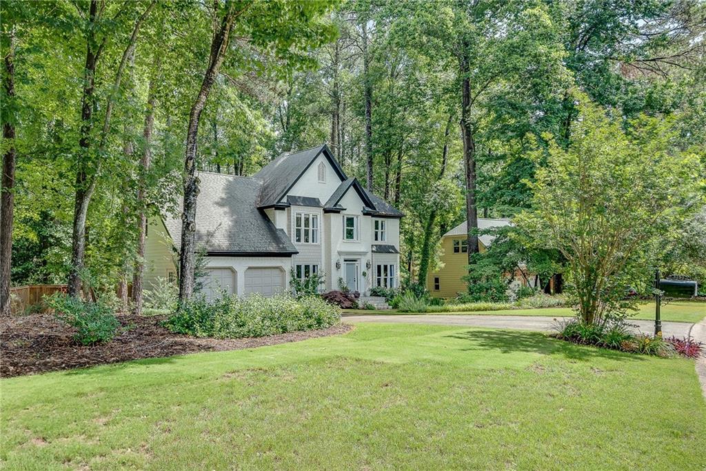This beautifully updated home in the desirable West Hampton neighborhood offers top-notch amenities, highly rated Cobb County schools, and a prime location just minutes from The Avenues of West Cobb, Kennesaw Mountain, and Downtown Marietta.
This Home Features an open floor plan with stunning hardwood floors throughout the first and second levels. The spacious living room features a cozy fireplace, complemented by a separate dining room and a versatile study/office accessible via internal French doors.
A stunning, fully renovated kitchen boasts quartz countertops (including a waterfall edge), stainless steel appliances, and plenty of storage. It opens to a bright, vaulted-ceiling family room or breakfast nook, filled with natural light from multiple windows, including a cathedral-style window. A large sunroom seamlessly connects indoor and outdoor living spaces, providing the perfect area to relax and entertain.
A grand staircase to the second level makes a big statement, featuring a high ceiling with a beautiful cathedral-style window.
The second floor hosts an expansive primary bedroom suite with vaulted ceilings, a charming sitting area, a large walk-in closet, and a beautifully remodeled bathroom with a double vanity, freestanding bathtub, floor-mounted faucets, and a separate no-threshold walk-in shower. In addition, there are three spacious bedrooms and a double vanity family bathroom.
The finished basement adds extra living space with a family room, fireplace, bedroom, kitchenette, and remodeled bath.
GREAT UPGRADES IN THE PAST THREE YEARS INCLUDE: a fully remodeled kitchen, a remodeled primary suite bathroom, a remodeled basement bathroom, new energy-efficient windows throughout the house, refinished hardwood floors on the first floor, new hardwood floors on the second floor, new HVAC systems with a transferable 10-year parts warranty, fresh paint, replacement of both the main front and back doors, and a privacy-fenced backyard with an automatic sprinkler system.
With high-quality upgrades and modern finishes, this home is truly move-in ready. Don’t miss the opportunity to make it yours!