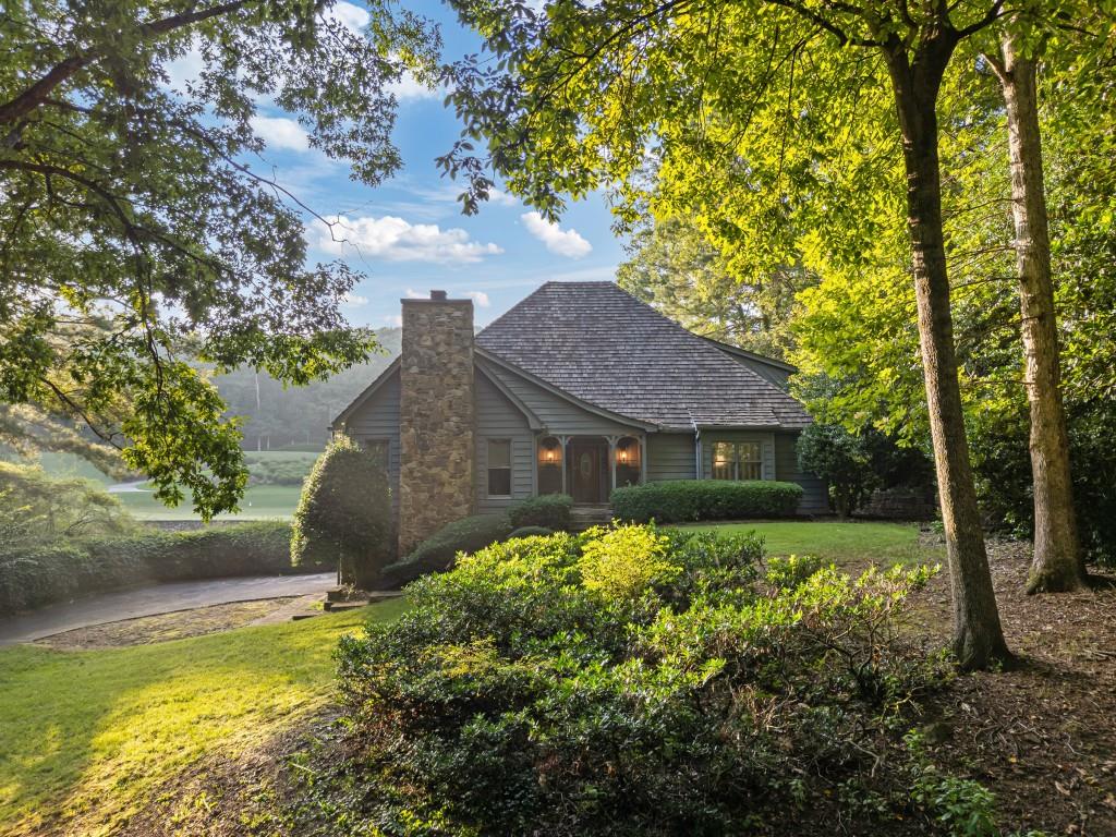 Unmatched Golf Course Views on Cherokee - Renovation Opportunity in Huntcliff. Perched on a premier lot along the Cherokee Town & Country Club golf course, this property offers an incredible opportunity to renovate and customize in one of Sandy Springs' most established and sought-after communities. With breathtaking, unobstructed views of the fairway and a picturesque pond, the setting is truly one-of-a-kind. The home features 5 bedrooms and 4 full baths, including two bedrooms on the main level, a soaring two-story entry, vaulted great room, sunroom, and solarium all oriented to take full advantage of the stunning backdrop. Whether refreshed or fully reimagined, the existing structure offers a solid foundation for your vision. Located in the heart of Huntcliff, a vibrant, amenity-rich community featuring swim and tennis, a clubhouse on the Chattahoochee River, and a private equestrian center with resident trainer. Minutes to Sandy Springs, Roswell's Riverwalk, and with easy access to Buckhead and major highways. Homes with this level of view, setting, and potential rarely come available. Bring your architect or designer this is a renovation opportunity you don't want to miss.