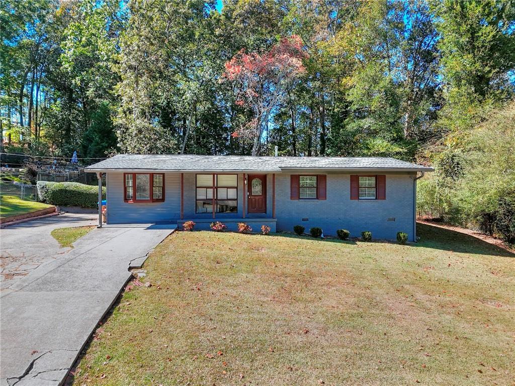 Welcome to 2725 Shoreland Drive SW, a beautifully renovated 3-bedroom, 2-bath ranch in the heart of southwest Atlanta offering the perfect blend of modern comfort and timeless charm. Step inside to an open-concept living and dining area filled with natural light, featuring stunning marble countertops, updated fixtures, and sleek finishes throughout. The spacious kitchen flows seamlessly into the main living space, while elegant French doors open to a private, wooded backyard featuring a fire pit. Perfect for entertaining, relaxing, or enjoying morning coffee in peace. With major updates completed in 2022, including a new roof, HVAC, and electrical system, this home is truly move-in ready. Located just minutes from downtown Atlanta and Hartsfield-Jackson Airport, it offers both convenience and tranquility, all with no HOA restrictions. A rare gem ready to welcome you home!