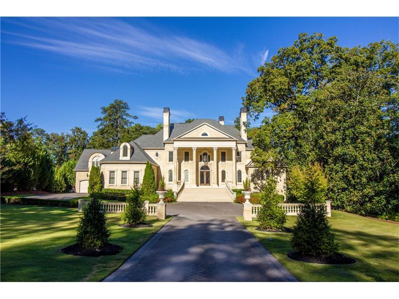 This incomparable neoclassical sits on 2+ac in the heart of Buckhead. The grand 2-sty foyer invites w/ a sweeping serpentine staircase & domed ceiling. Flanked by an elegant DR & a handsome, 2-sty library w/ spiral staircase & rich wood paneling, the foyer leads to the 2-sty great rm. Marble floors continue t/out the main level & seamlessly transition to limestone floors in the kit. The fam rm & each rm on this level highlight the stunning views out to the pool/tennis in the bckyd. Oversized molding, exceptional finishes & intricate stonework adorn each rm in this home.