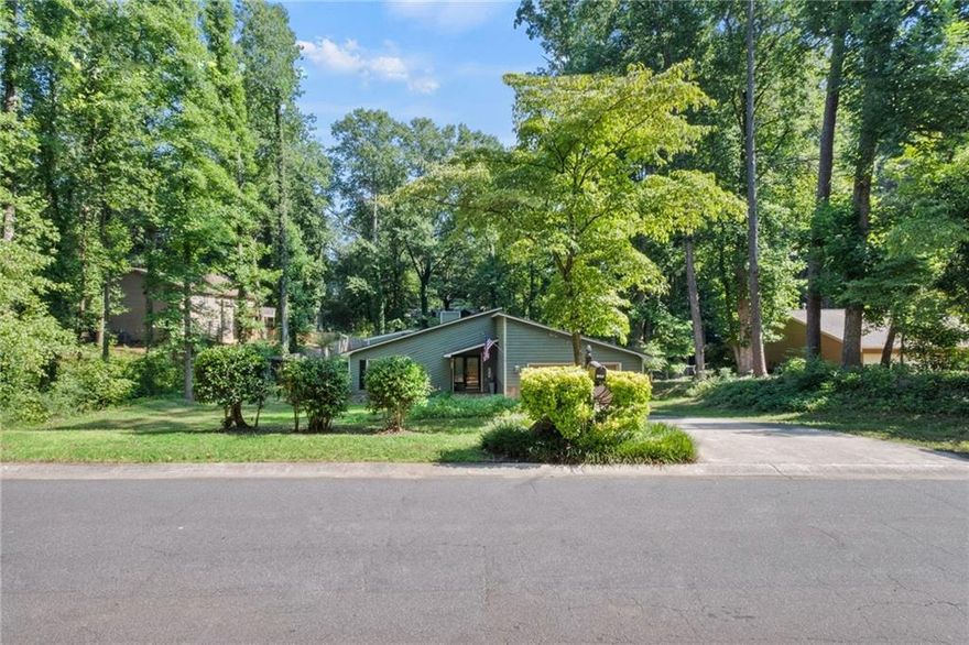 REMODELED CONTEMPORARY ONE STORY RANCH HOME ON HALF ACRE LOT IN DESIRABLE EAST COBB LOCATION.