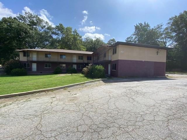 Amazing Apartment Investment Opportunity in the heart of the rapid-growing City of East Point. Located in the heart of downtown, just off of main street before entering Historic College Park sits a 75-Unit apartment complex on just over 5 acres of land. There are a total of 8 buildings in this complex. The unit breakdowns are as follows: 40 2bed/1bath units and 35 1bed/1bath units, plus a leasing office, multiple storage rooms for construction/maintenance supplies and a laundry facility. Five of the buildings have tenants in place, while the remaining three buildings are under construction. Two of the buildings that are under construction are near completion with only punch-list type items remaining to be done. One of the buildings that is under construction still needs a full renovation as it currently only has studs in place. Rent rolls, T12, additional photos of each unit can be sent upon request. Property is located at the end of the street where Dunlap and Vesta meet. There's plenty of parking and even enough land to build another building for units and/or create a playground for the community. Don't miss out on this wonderful opportunity. Recent as-is appraisal and ARV appraisal can be provided. Showings are by appointment only.