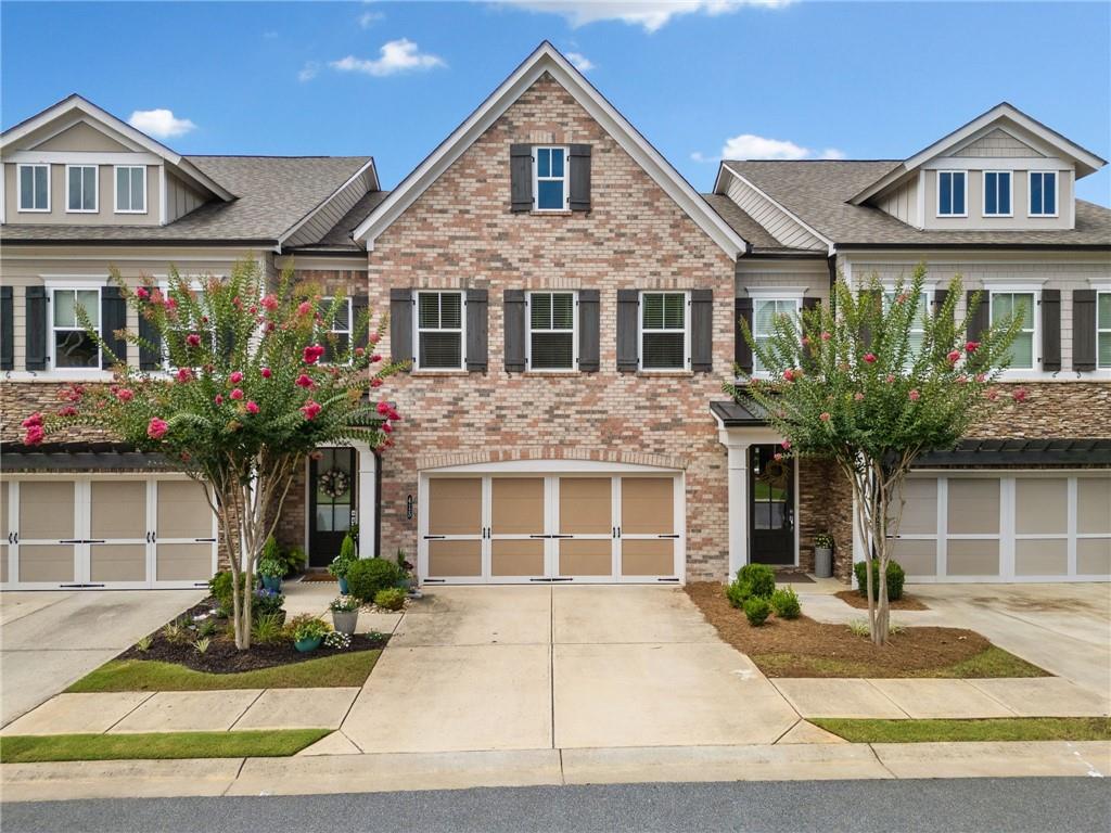 This beautifully maintained 3-bedroom, 2.5-bath townhome offers over 2,500 square feet of spacious, modern living. The open floor plan features hardwood floors, a cozy fireplace, and a gourmet kitchen with stainless steel appliances, granite countertops, and an oversized island—perfect for entertaining. Upstairs, you'll find a luxurious primary suite with a spa-like bath and generous closet space. Enjoy your morning coffee on the private covered patio or take advantage of the community amenities, including covered barbeque area and dog park. Conveniently located just minutes from vibrant Downtown Roswell and Downtown Woodstock, shopping, dining, and top-rated schools. This is low-maintenance living at its finest! Home has an elevator shaft if you want to have one installed.