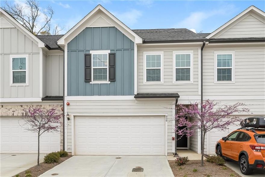 This meticulously maintained, like-new townhome offers carefree living within walking distance to the Marietta Square with 2100 sqft. The open main level features engineered wood floors, a chef’s kitchen with white quartz counters, a five-burner gas cooktop, an expansive island, and stainless steel smart appliances, seamlessly flowing into the open dining area and sunlit living area with its wall of windows—perfect for entertaining. Step outside to the back patio on one of the more private lots in the neighborhood. Upstairs, walk right into the loft which provides great space for a second living area, perfect for movie nights or a home office.  Two sun-filled bedrooms share a hall bath, while a spacious laundry room adds convenience upstairs. The private primary suite is its own sanctuary with double-door entry and ample lighting. The spa-like primary bath is covered in gorgeous tile with a frameless glass fully tiled shower, separate soaking tub, dual vanity, linen closet, and a large walk-in closet. Additional conveniences include a two-car garage with electric car charging and numerous smart home features. An HOA that handles exterior maintenance, lawn care, and termite control makes for carefree living. Community perks include a dog park, guest parking, fire pit, and walking trails. Don’t miss your chance to enjoy a walkable lifestyle in this highly desired location, just a short walk over the pedestrian path to Marietta Square- with its weekly farmers market, food hall, frequent events, with local dining and shopping options!