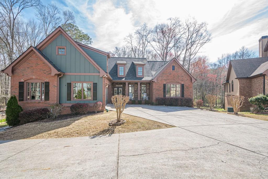 Welcome to this custom-built gem nestled on the largest lot in the subdivision, offering space, privacy, and endless possibilities! Located in a top-rated school district, this stunning home boasts exceptional craftsmanship and thoughtful details throughout. Step inside to find hardwood floors throughout the main level, leading to a spacious primary suite with a luxurious ensuite bathroom. The huge kitchen is a chef' s dream, featuring custom cabinetry, stainless steel appliances, and a bright breakfast area. The large secondary bedrooms provide ample space for family and guests, including a perfect guest suite/bonus room upstairs with its own private ensuite bathroom. The finished basement is a true retreat, complete with a private bedroom, full bathroom, and game room. A dedicated workshop in the basement offers the opportunity to be finished for additional living space. Enjoy the outdoors from the enclosed porch or the expanded deck, both overlooking the beautiful private backyard ideal for relaxation or entertaining. The extended driveway offers additional parking space, accommodating multiple cars, and even includes a carport big enough for an RV. Home also includes a BRAND NEW ROOF!!! For those who love to create and grow, this property also features a large workshop and a dedicated garden setup for anyone with a green thumb. With custom features throughout and endless possibilities, this incredible home is ready for its next owner. Don't miss out schedule your private tour today!