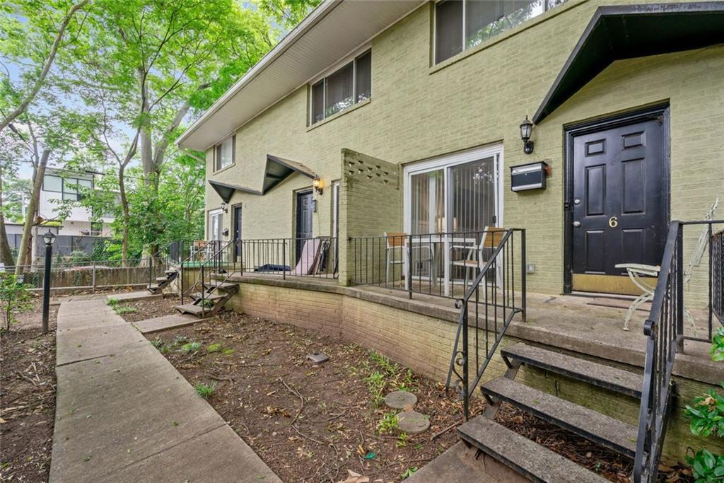 Incredible Opportunity Across from Piedmont Park! Welcome to 411 10th Street #6 – a fully renovated 2-bedroom, 1-bath condo in the heart of Midtown with no rental restrictions. Currently operating as a successful Airbnb, this bright, two-story home features a modern kitchen with new stainless steel appliances, spacious living areas, and large bedrooms. Enjoy morning coffee or evening concerts from your front porch, just steps from the park. Additional features include designated parking, a private storage unit, low HOA fees, and front and rear porches. Located in the sought-after Morningside/Midtown school cluster and offered fully furnished – this is a rare find for investors or owner-occupants looking to live or earn in one of Atlanta’s most walkable neighborhoods!